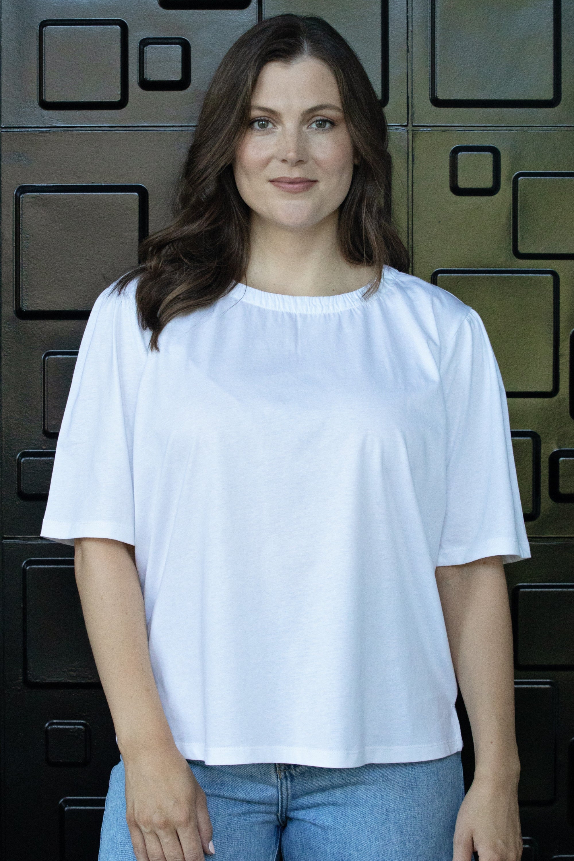 womens plain white tee with gather neckline worn by model