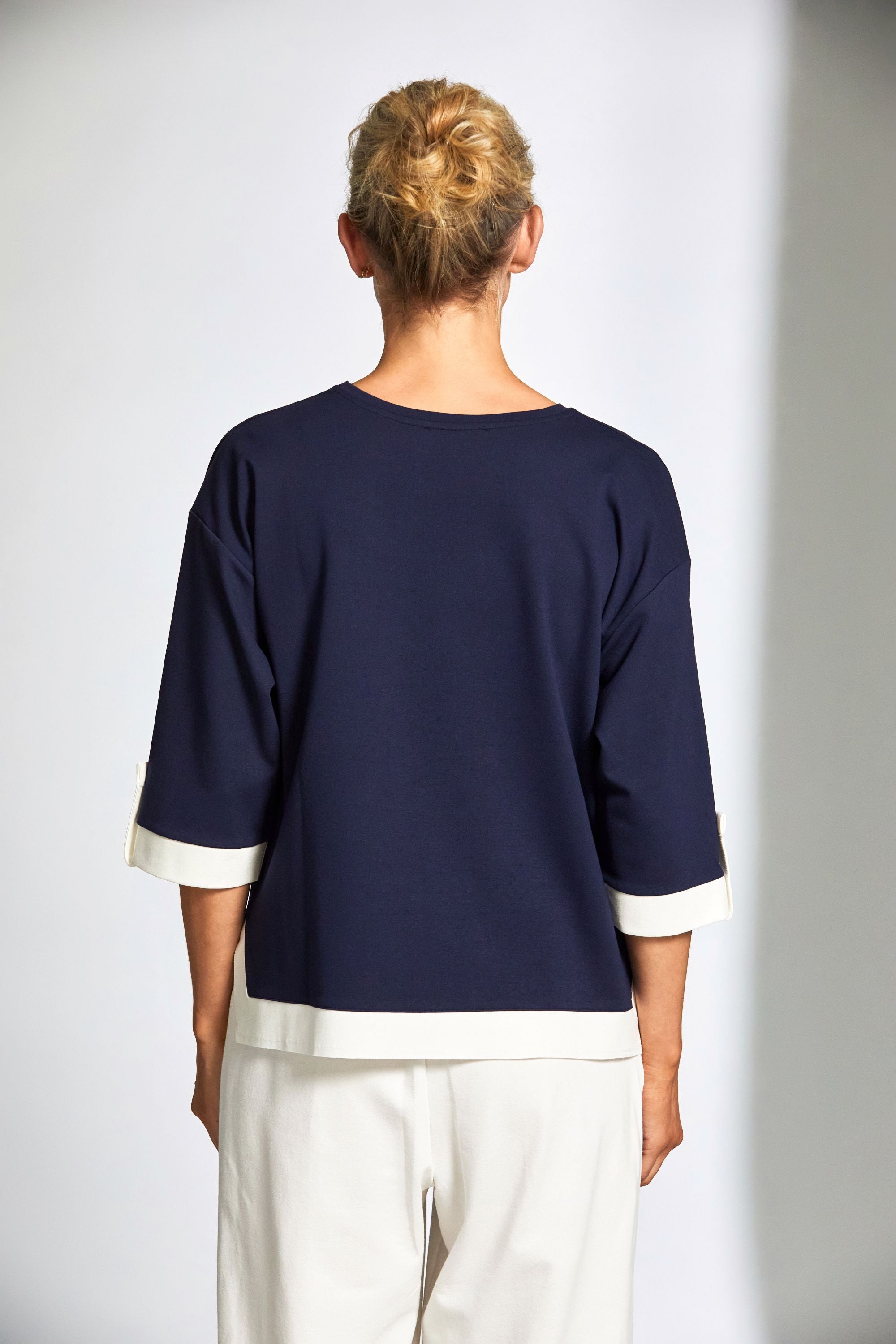 womens top in navy with ecru contrast details worn by model back view