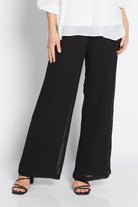 womens chiffon overlay wide leg pants black worn by model 