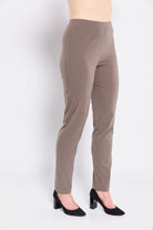 Brown pants worn by a person on a white background