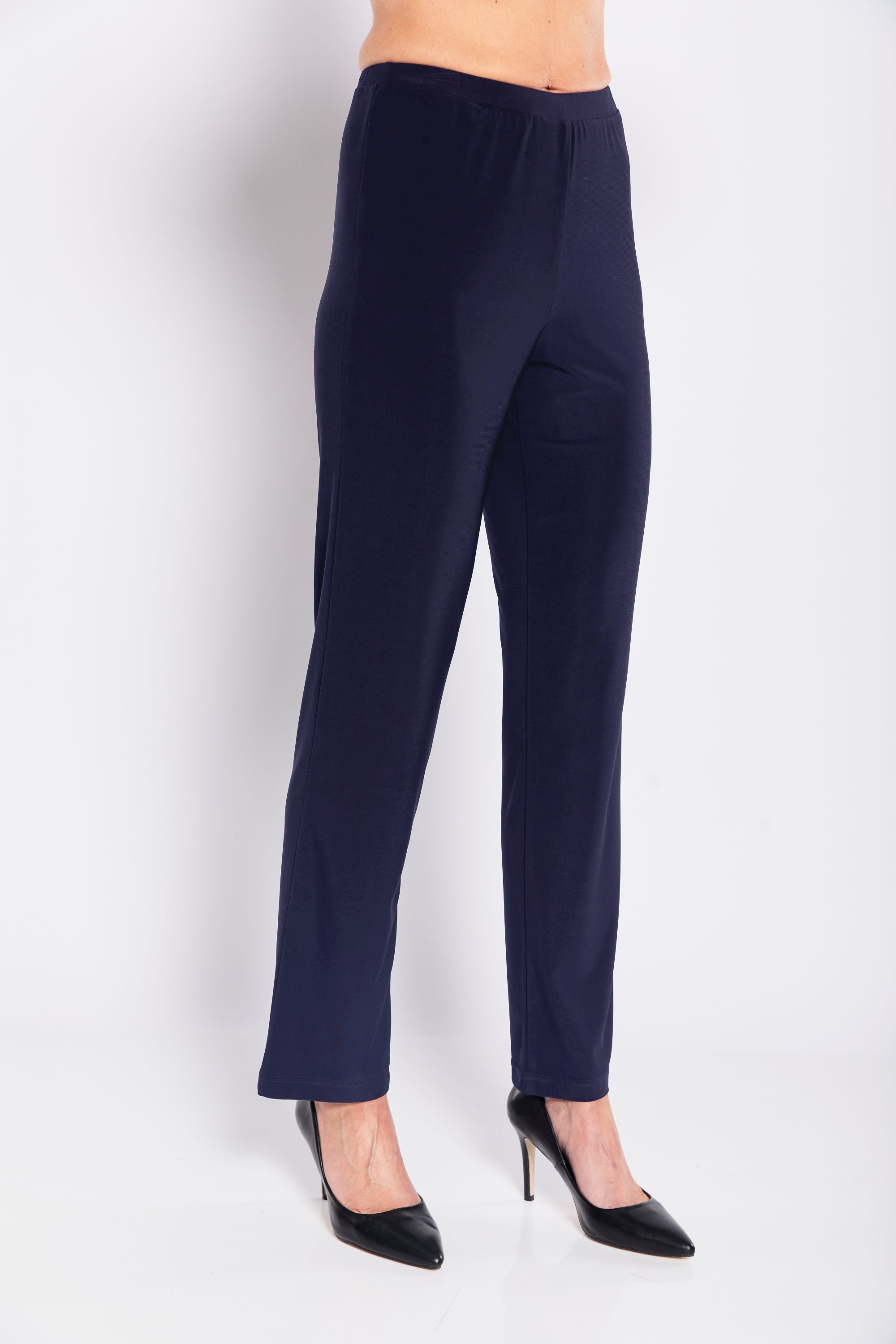 Navy blue pants worn by a person on a white background