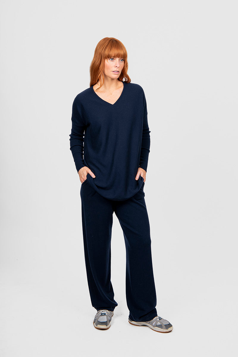 Person wearing a black outfit on a white background