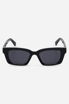 Black sunglasses with dark lenses on a white background