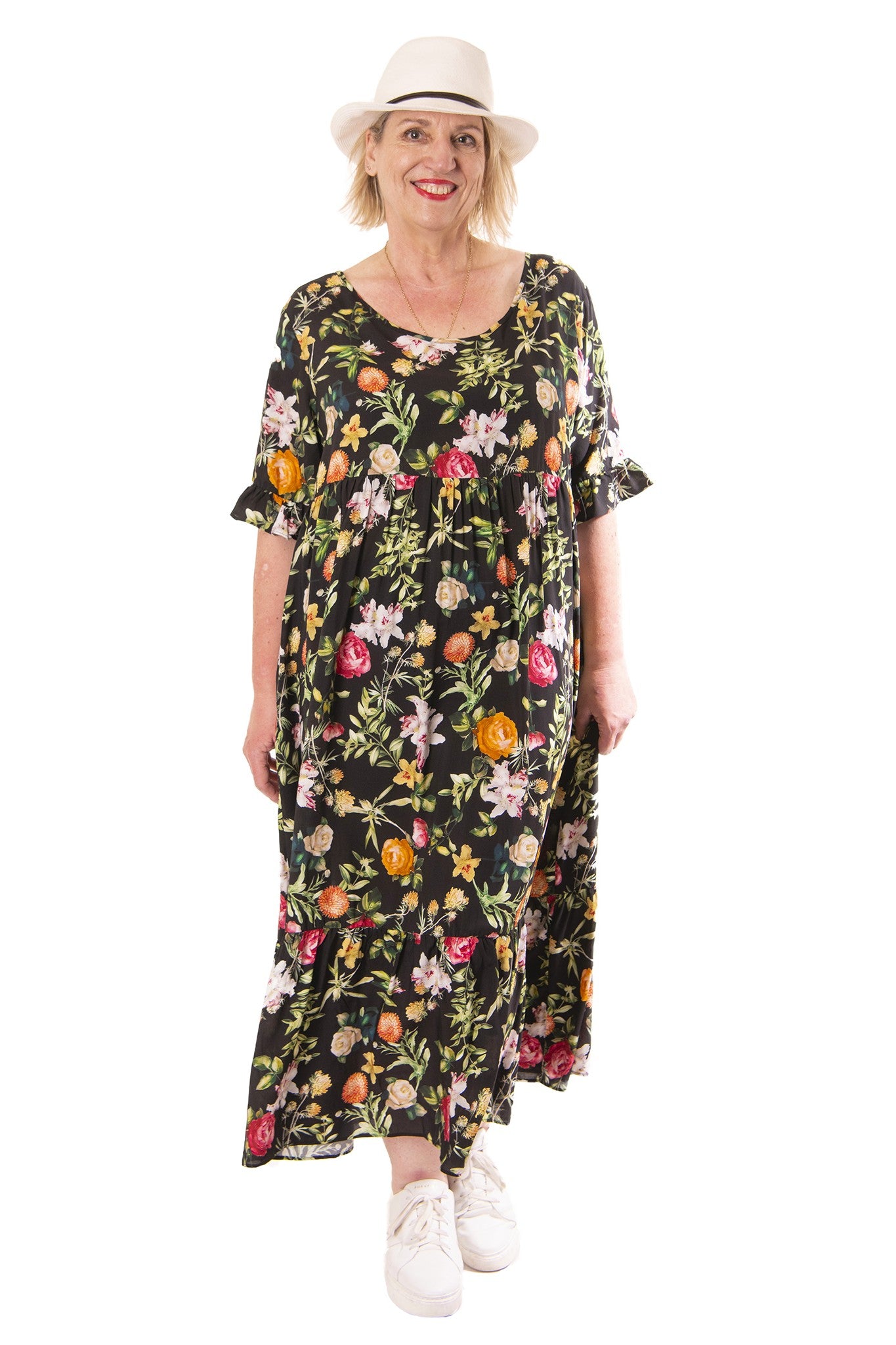 Woman wearing a floral dress with a white background