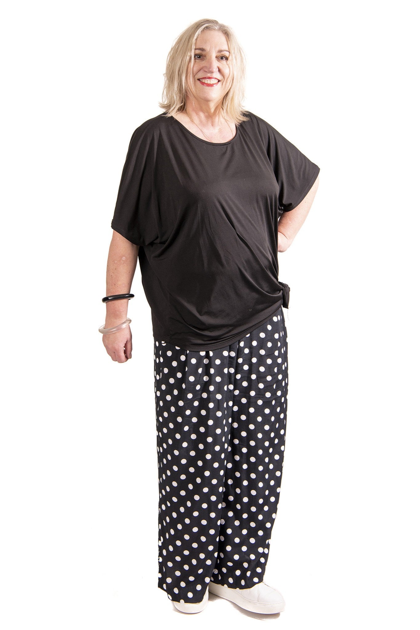 womens wide leg black white spot pant and black top worn by model 