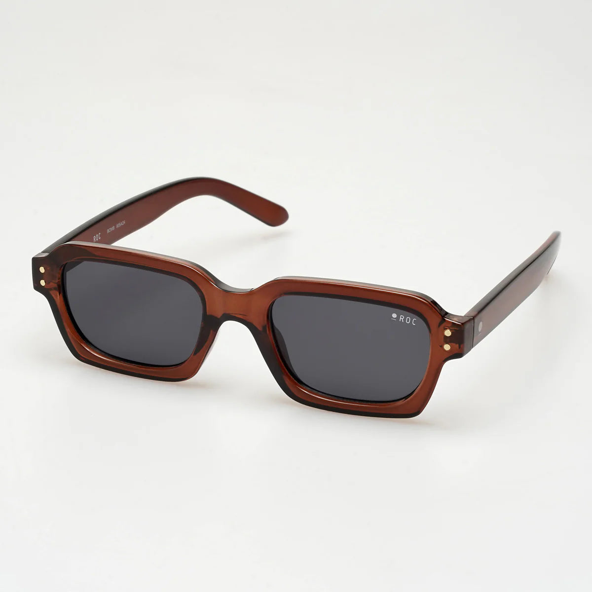 Brown sunglasses with dark lenses on a white background