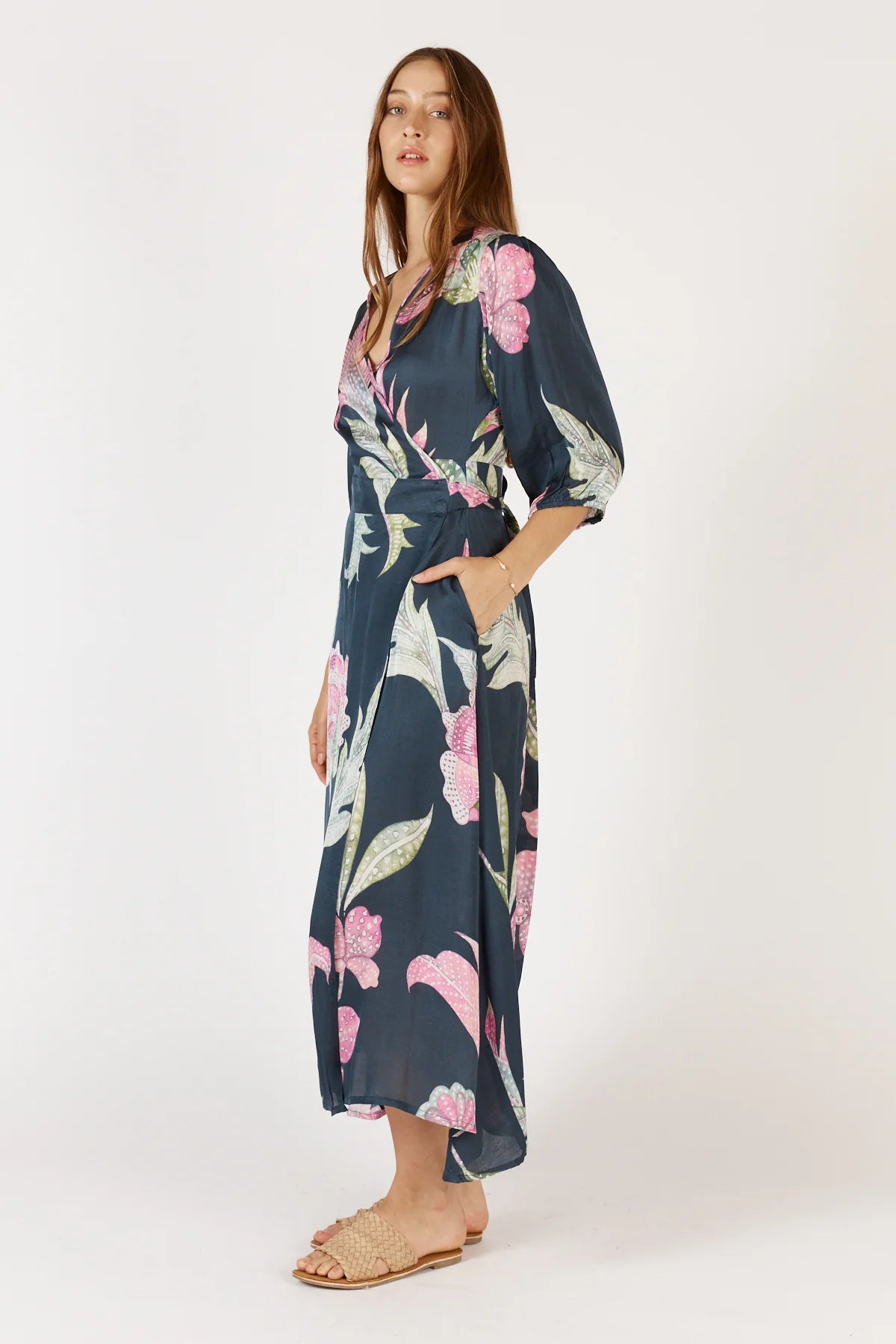 Woman wearing a floral dress on a white background