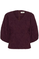Maroon blouse with puff sleeves on a white background