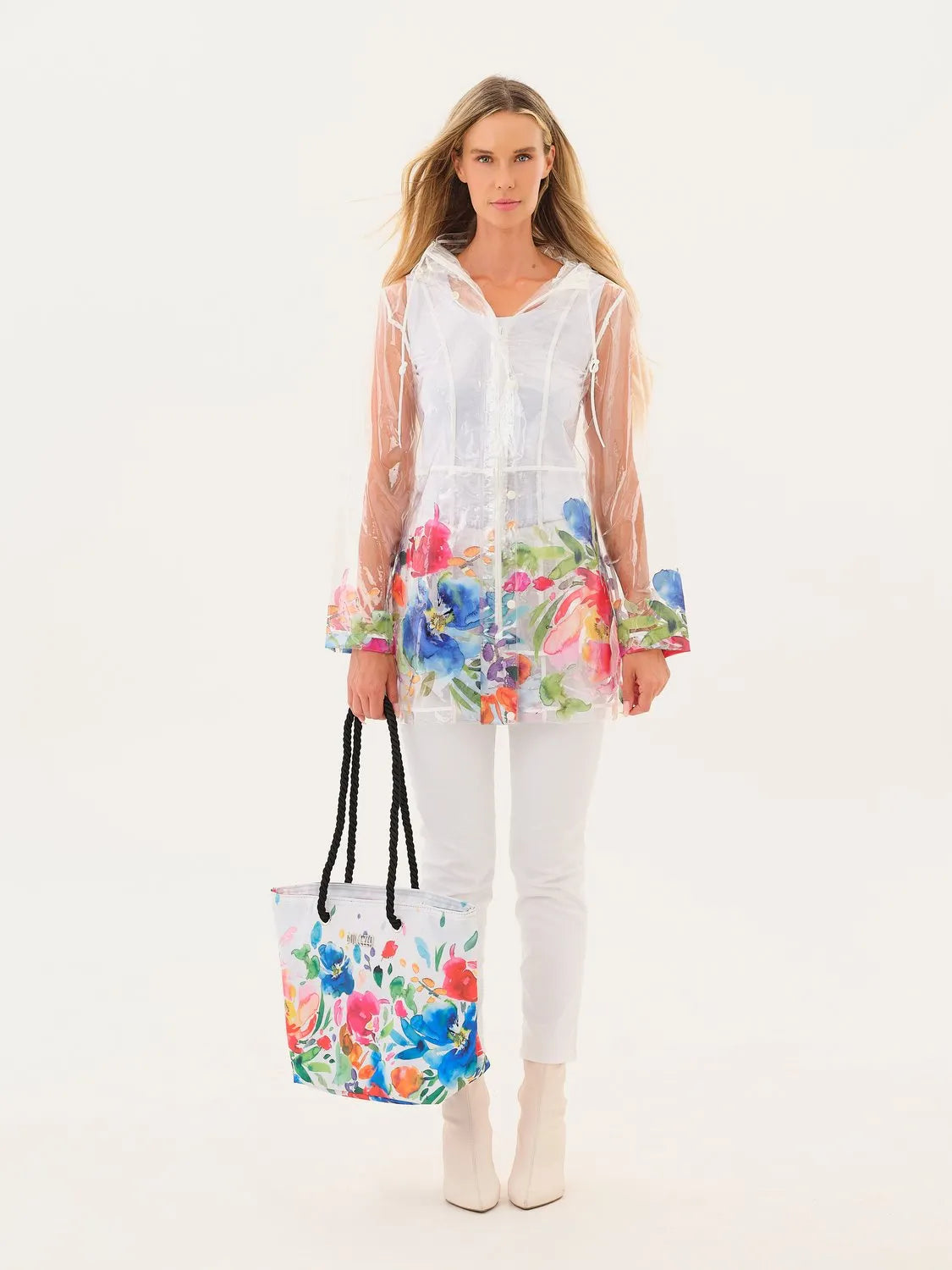 Woman wearing a white outfit with floral accessories on a white background