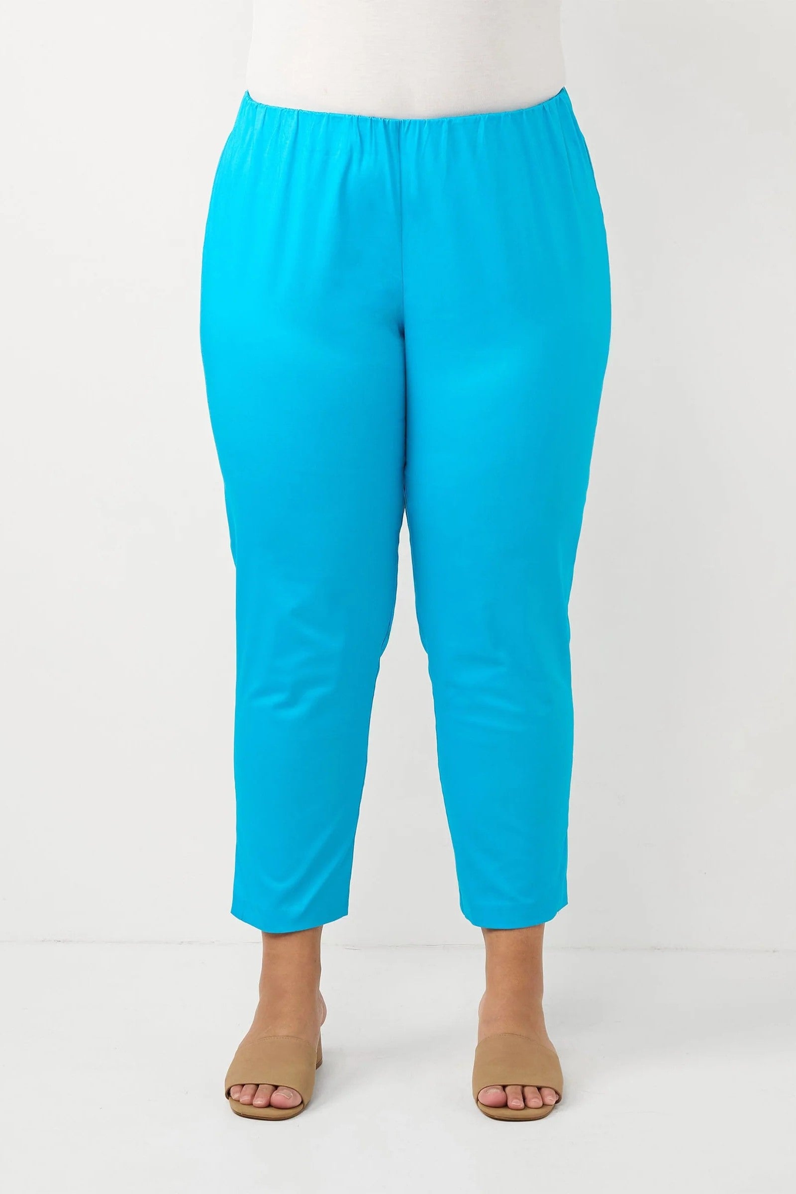 womens turquoise crop slim pants worn by model 
