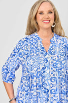 womens shirt blouse with blue white mediterranean print worn by model