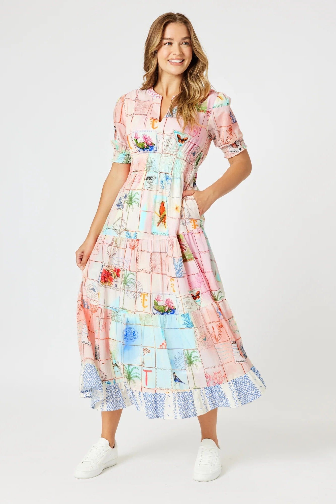 model wering pastel multi print maxi dress against white background