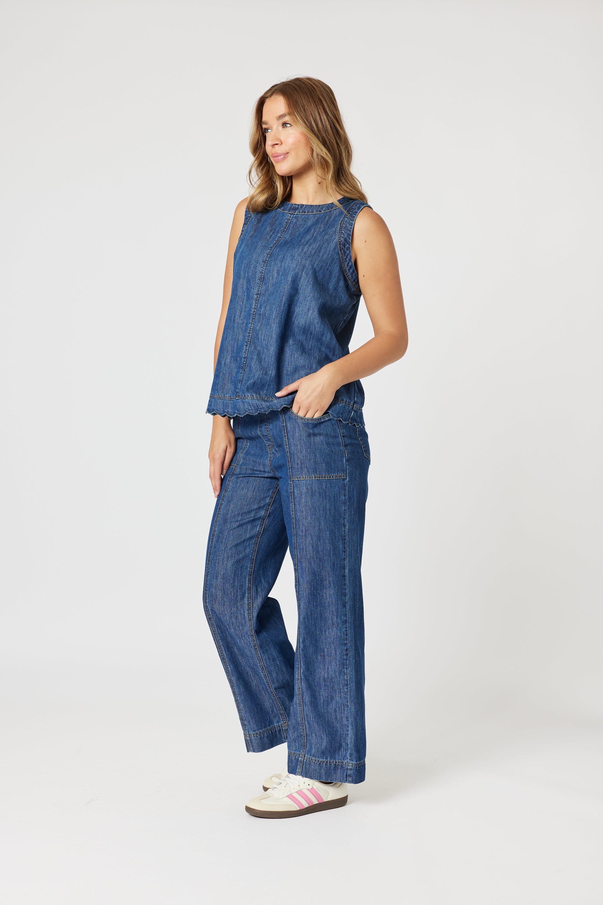 womens straight wide leg jean with top stitching mid wash worn by model side view