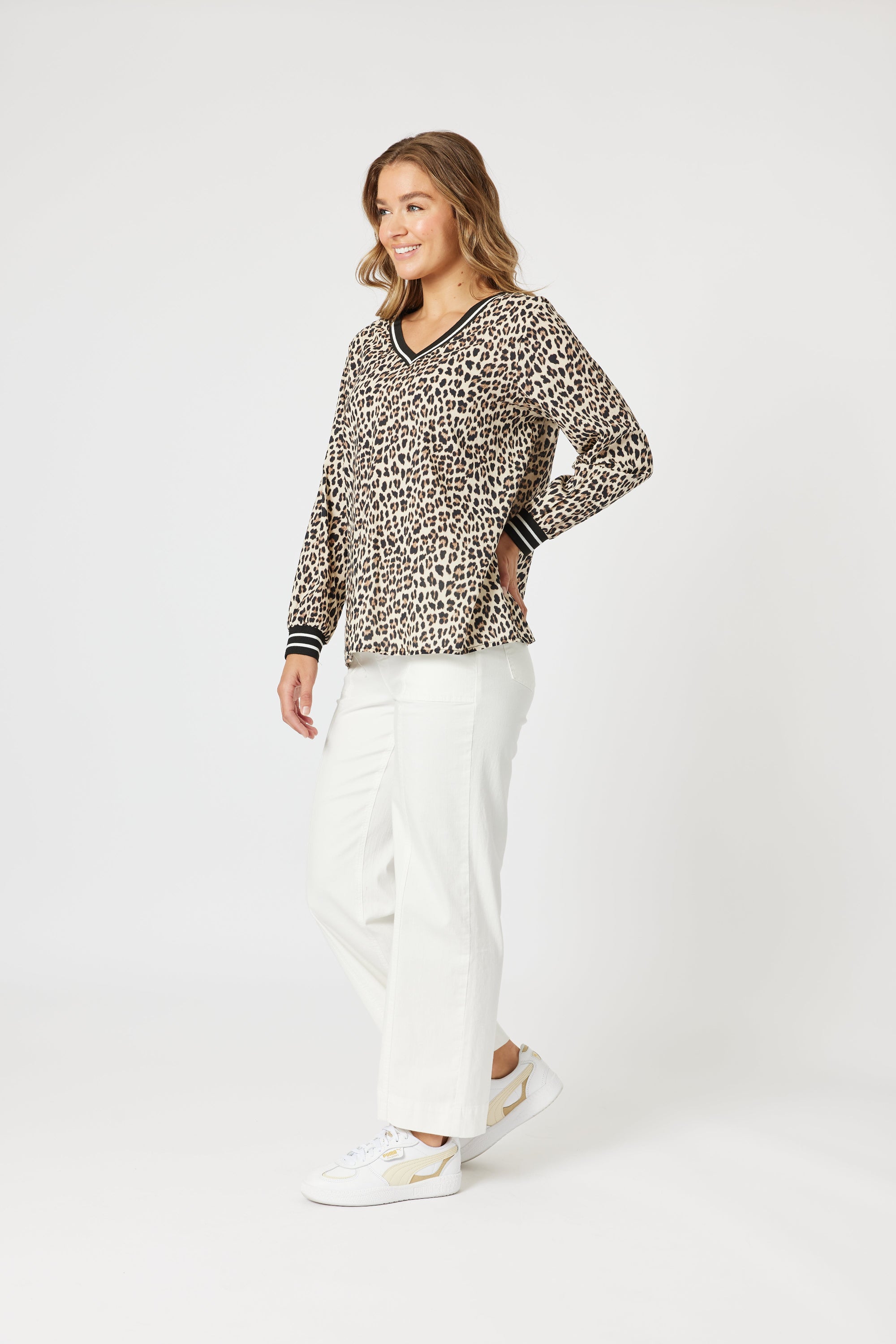 womens v neck leopard print top with black white contrast trims worn my model
