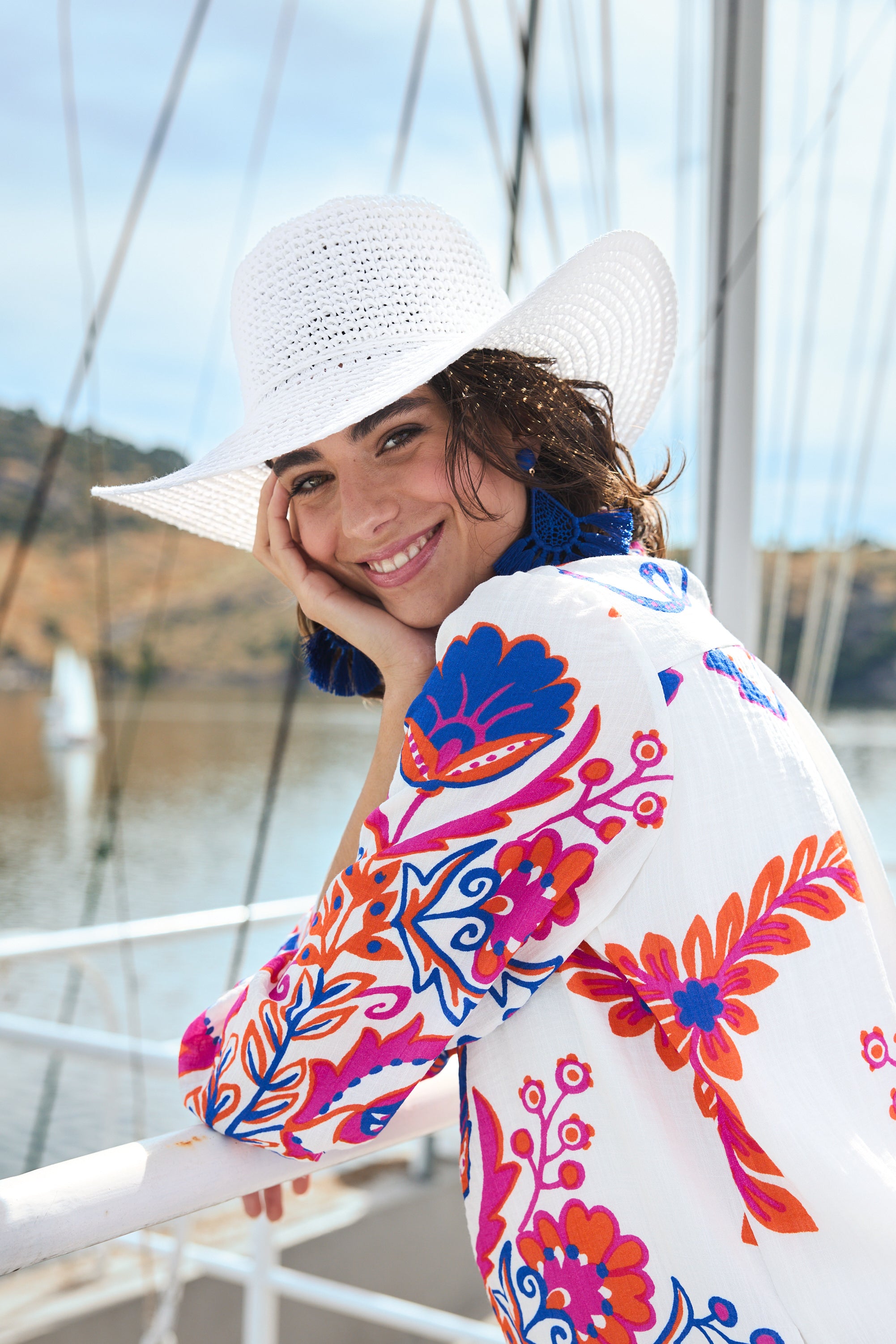 white with pink and blue print shift midi dress worn by model boat campaign close up