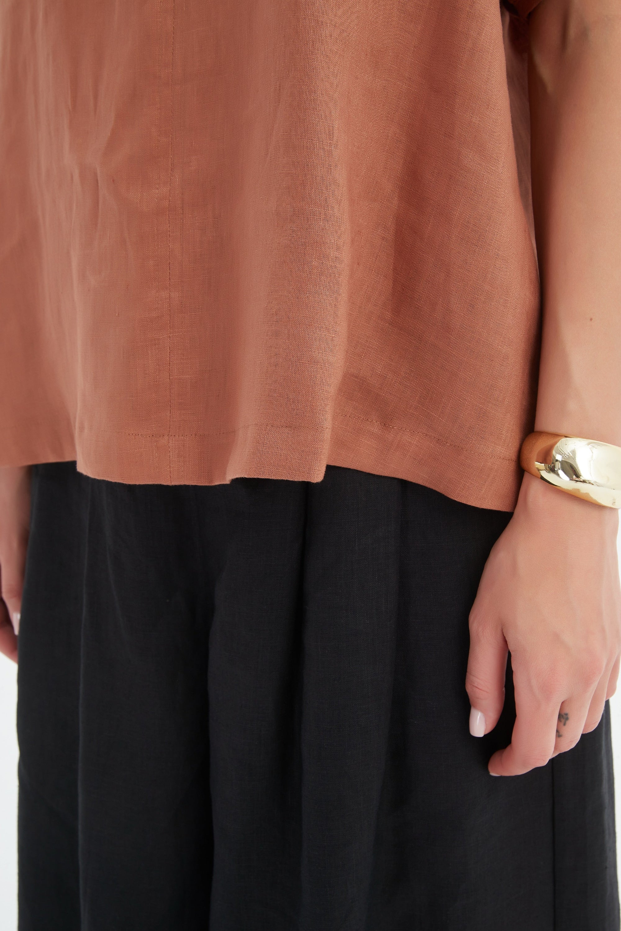 bishop sleeve v neck top in brown cedar worn by model 