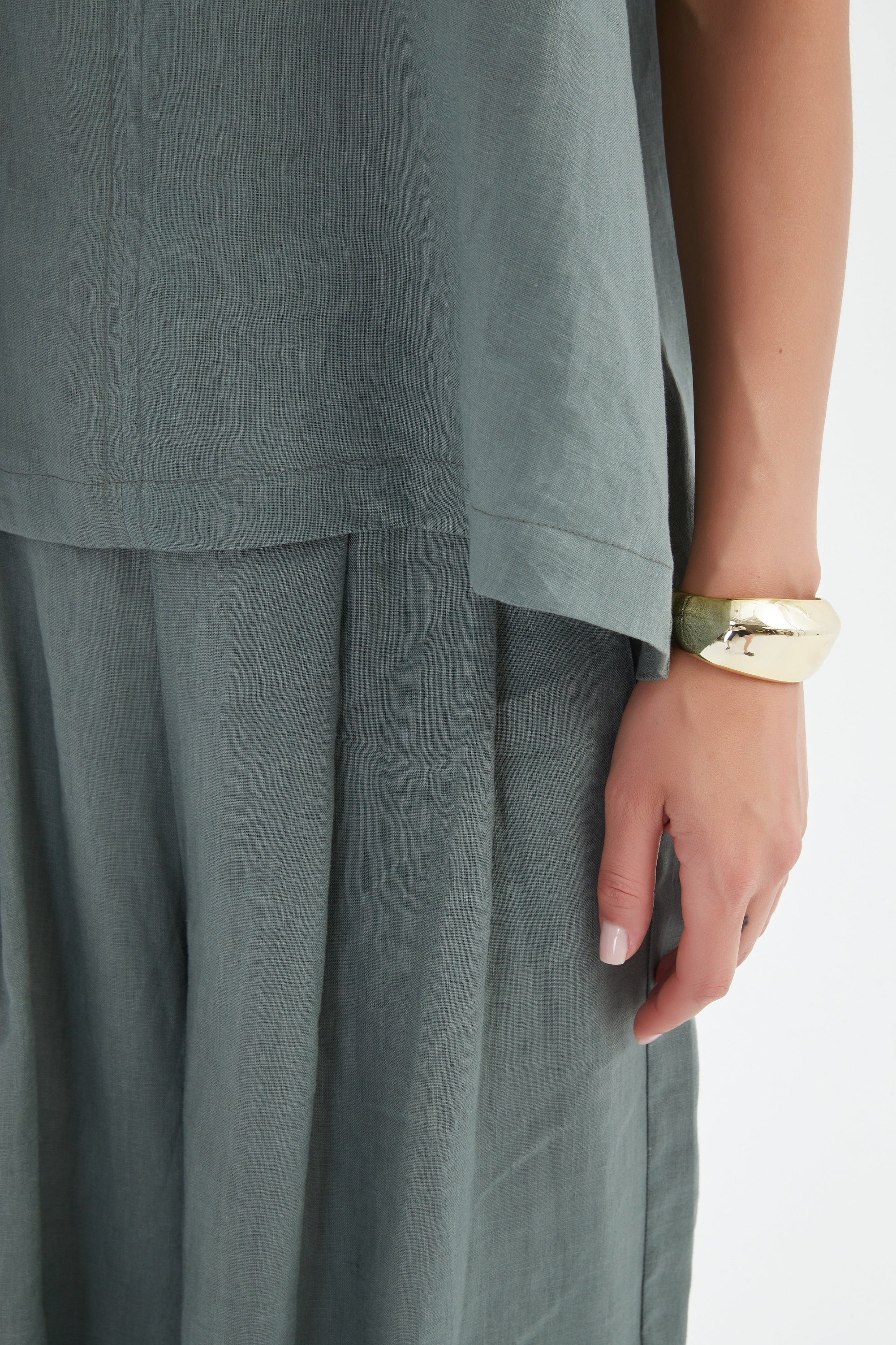 bishop sleeve v neck top in petrol worn by model close up