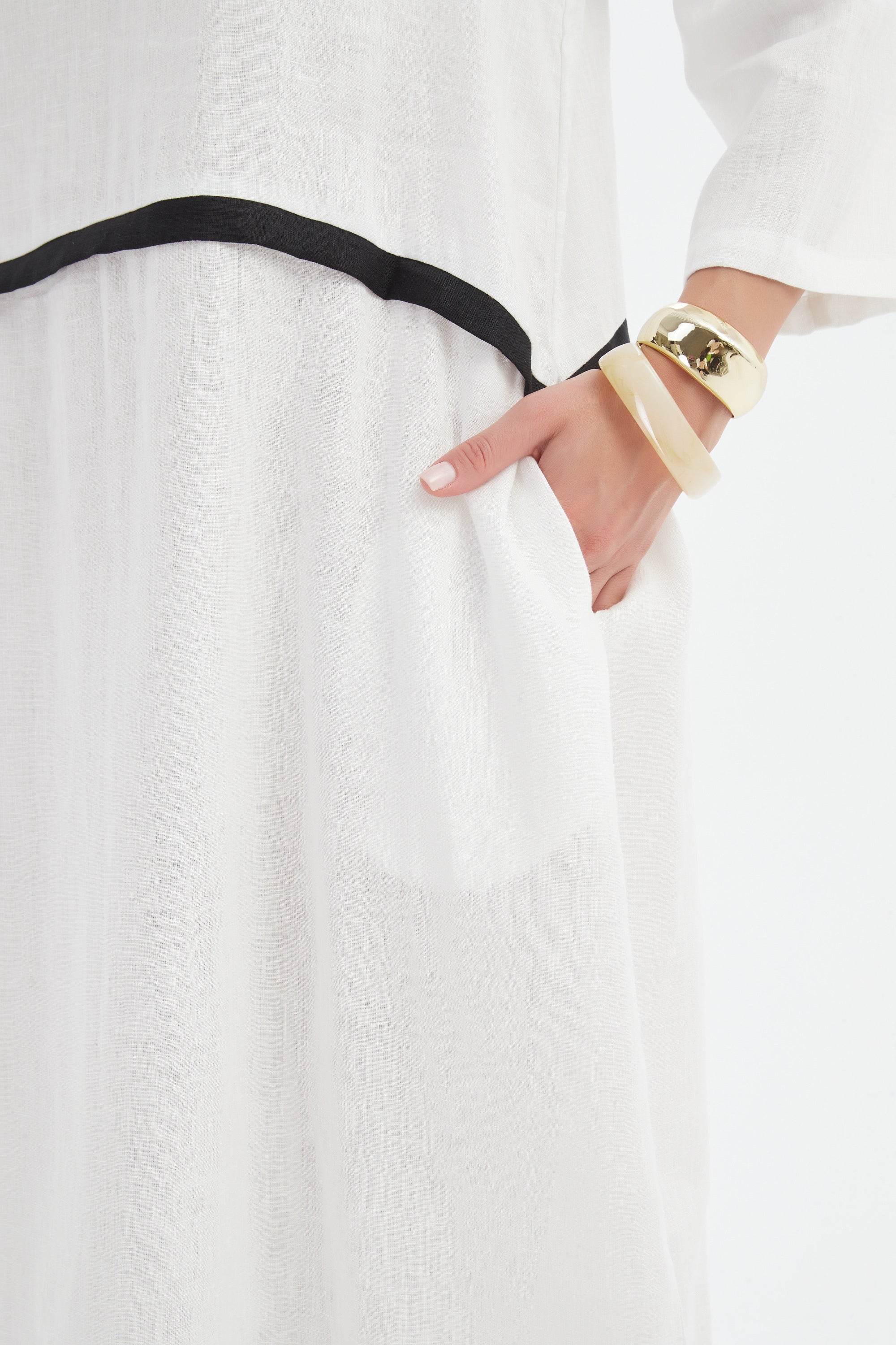 cream midi dress with black contrast worn by model detail