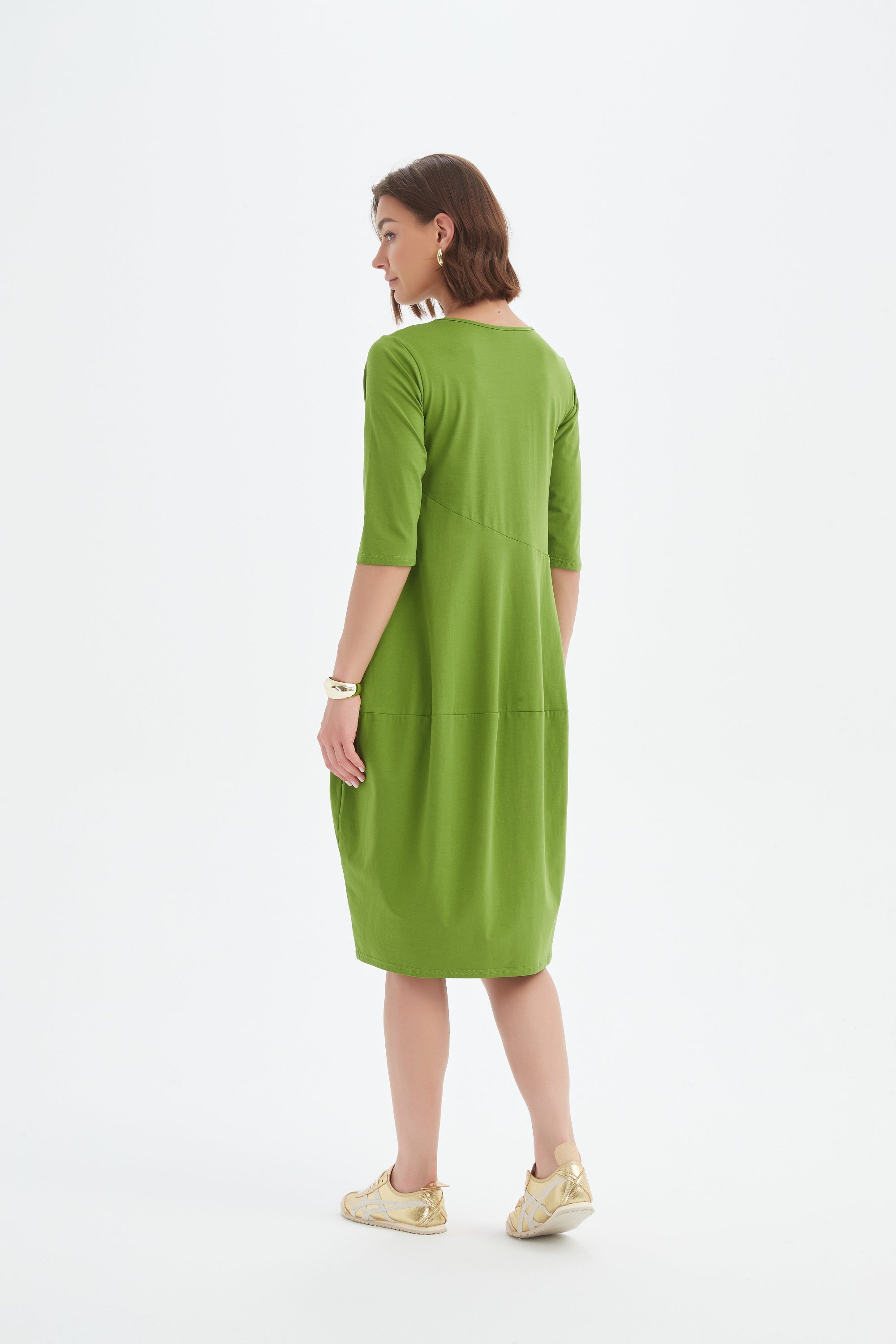 midi diagonal seam dress in green worn by model back view