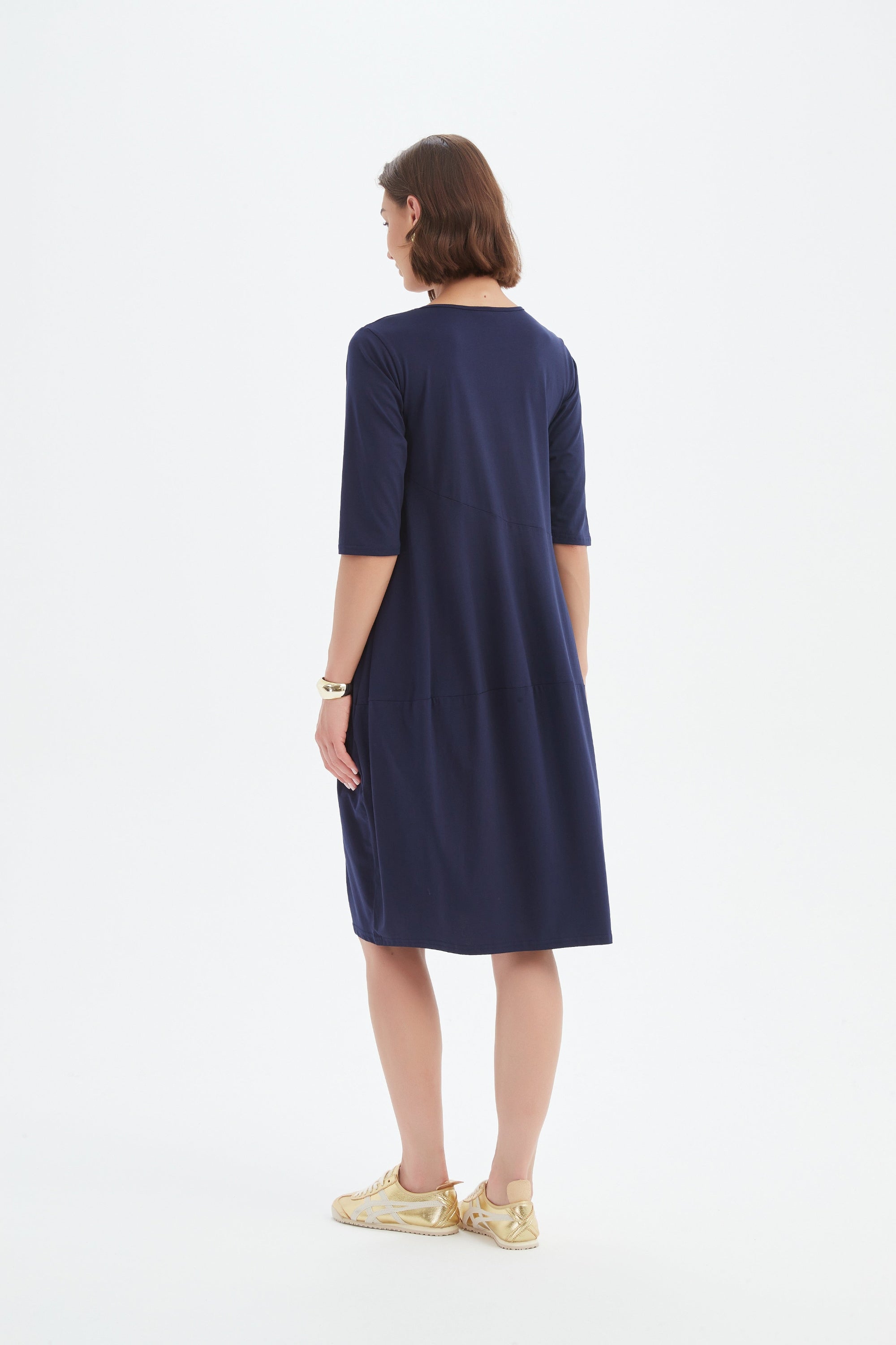midi diagonal seam dress in navy worn by model back view