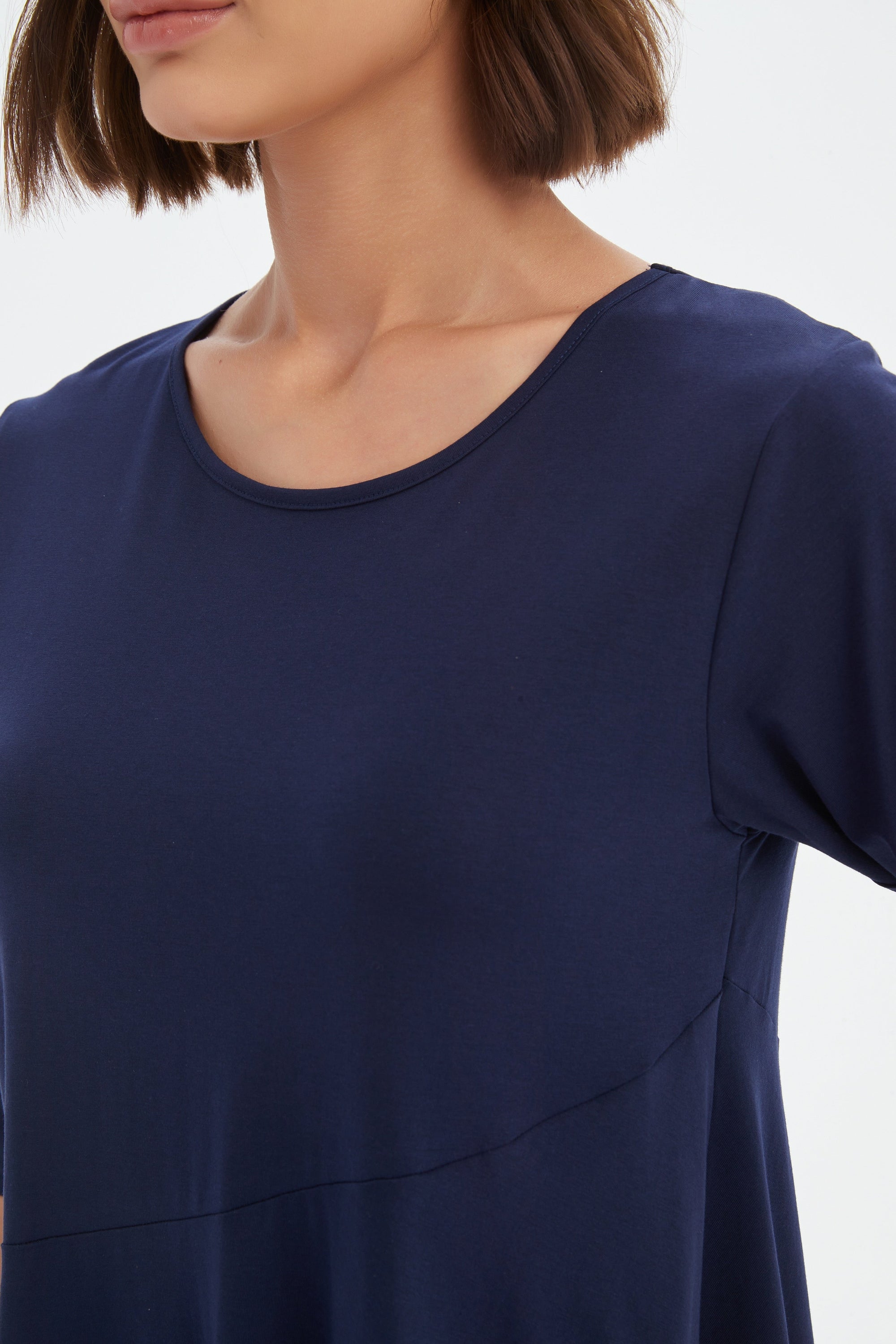 midi diagonal seam dress in navy worn by model close up