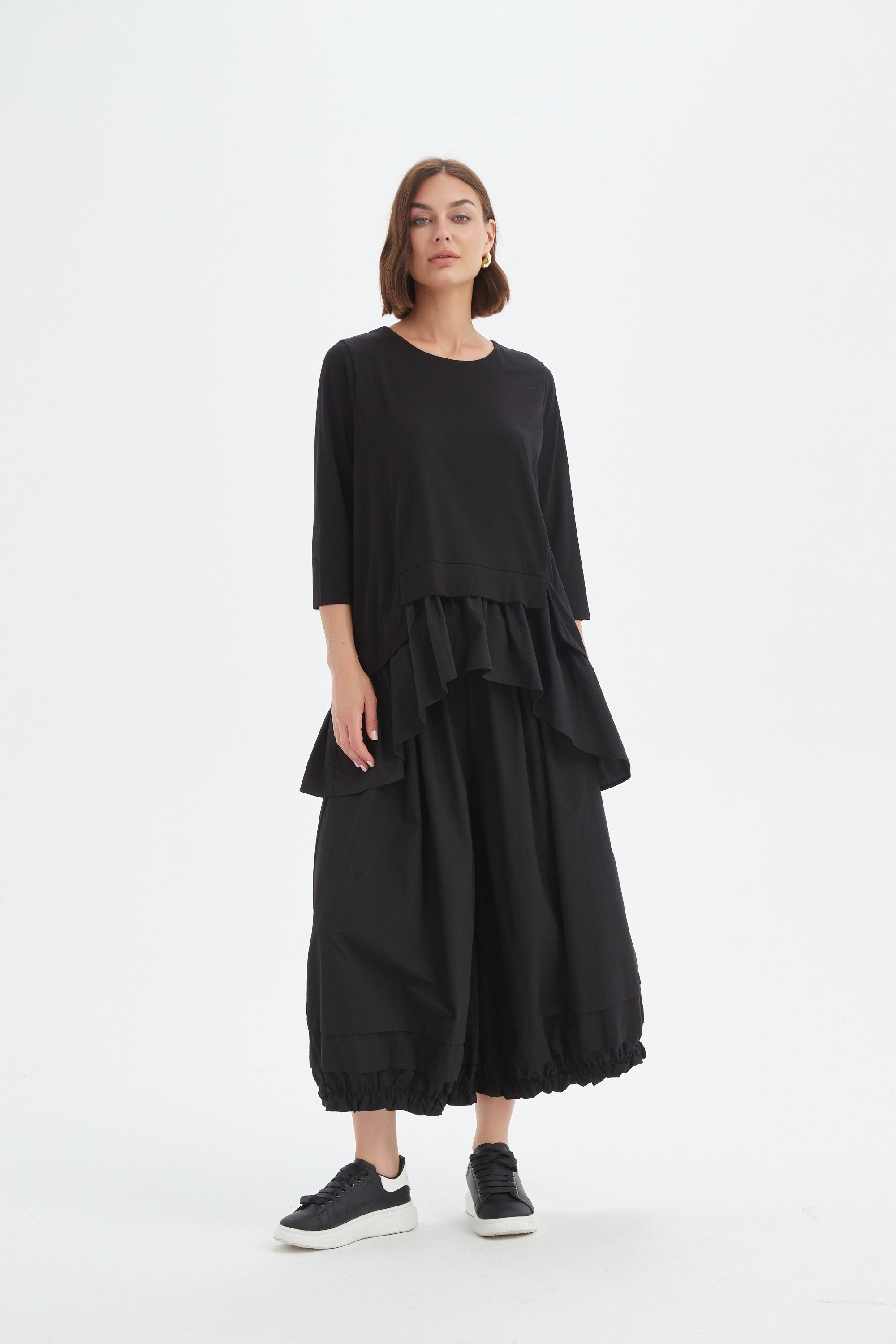 black combi top and skirt worn by model 