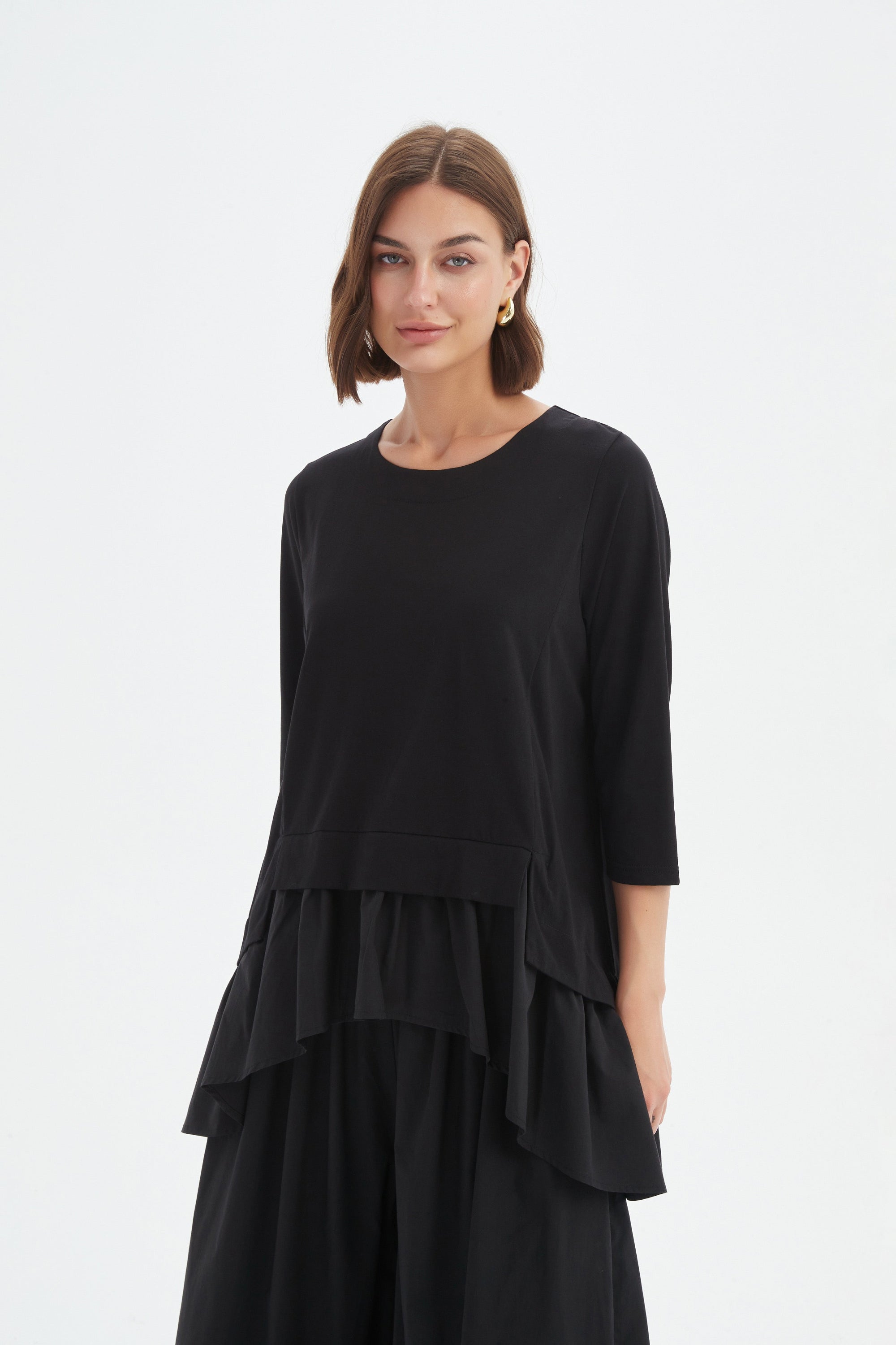 black combi top and skirt worn by model 