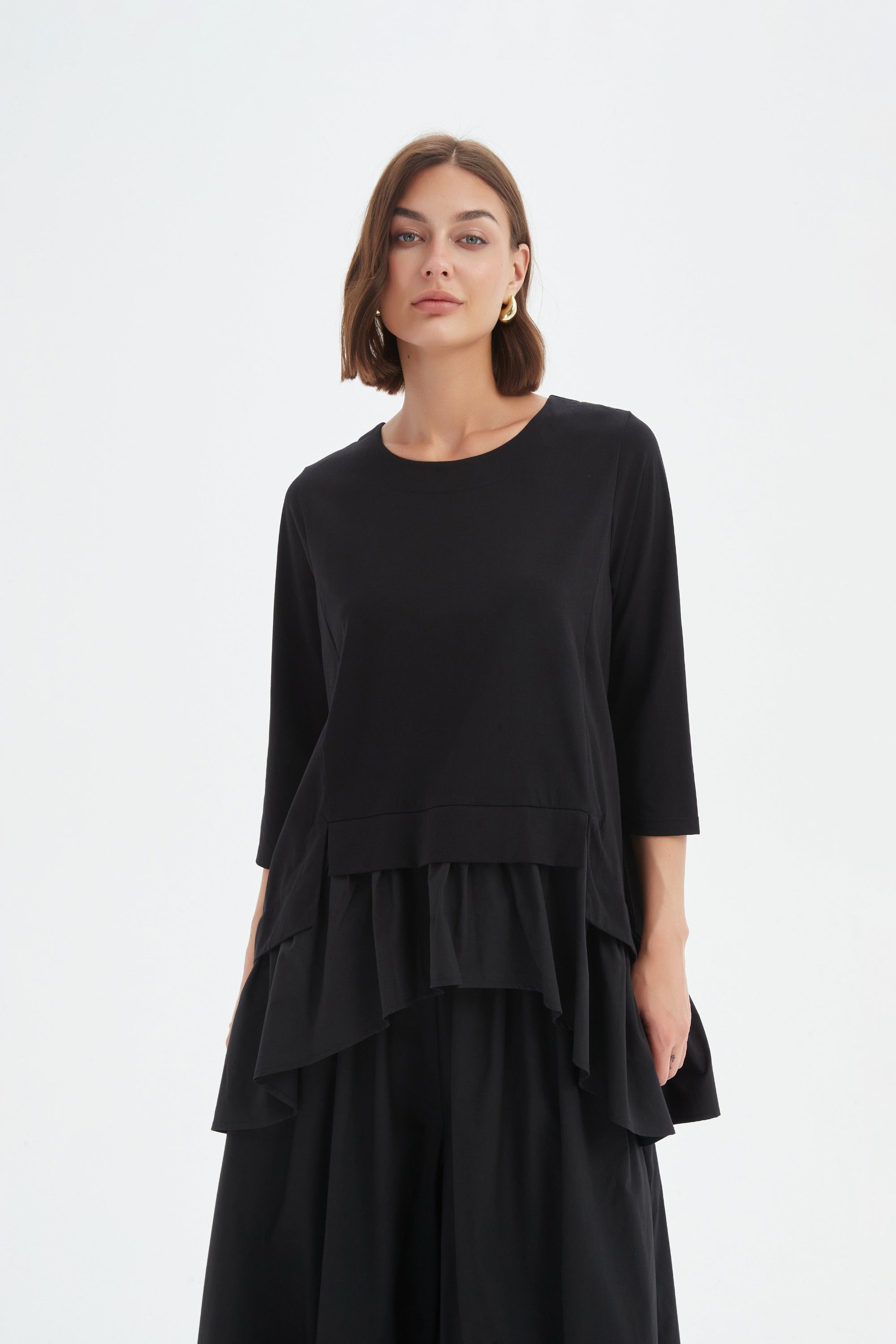 black combi top and skirt worn by model 