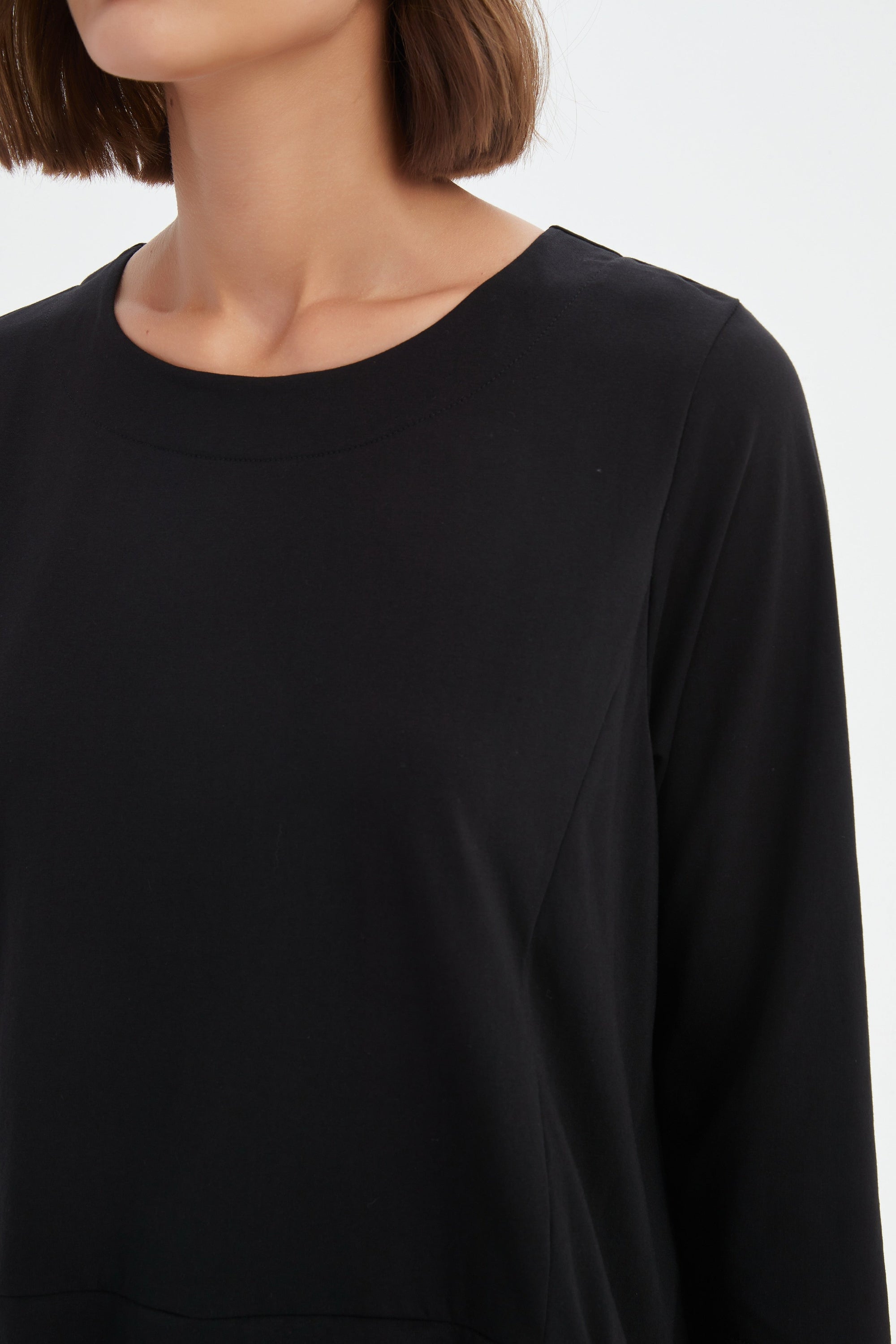 black combi top and skirt worn by model 