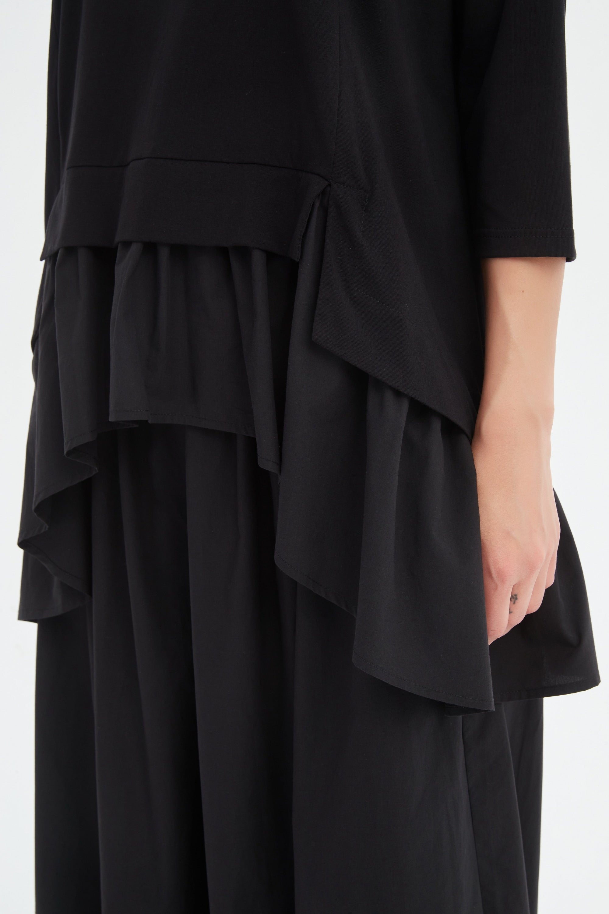 black combi top and skirt worn by model 