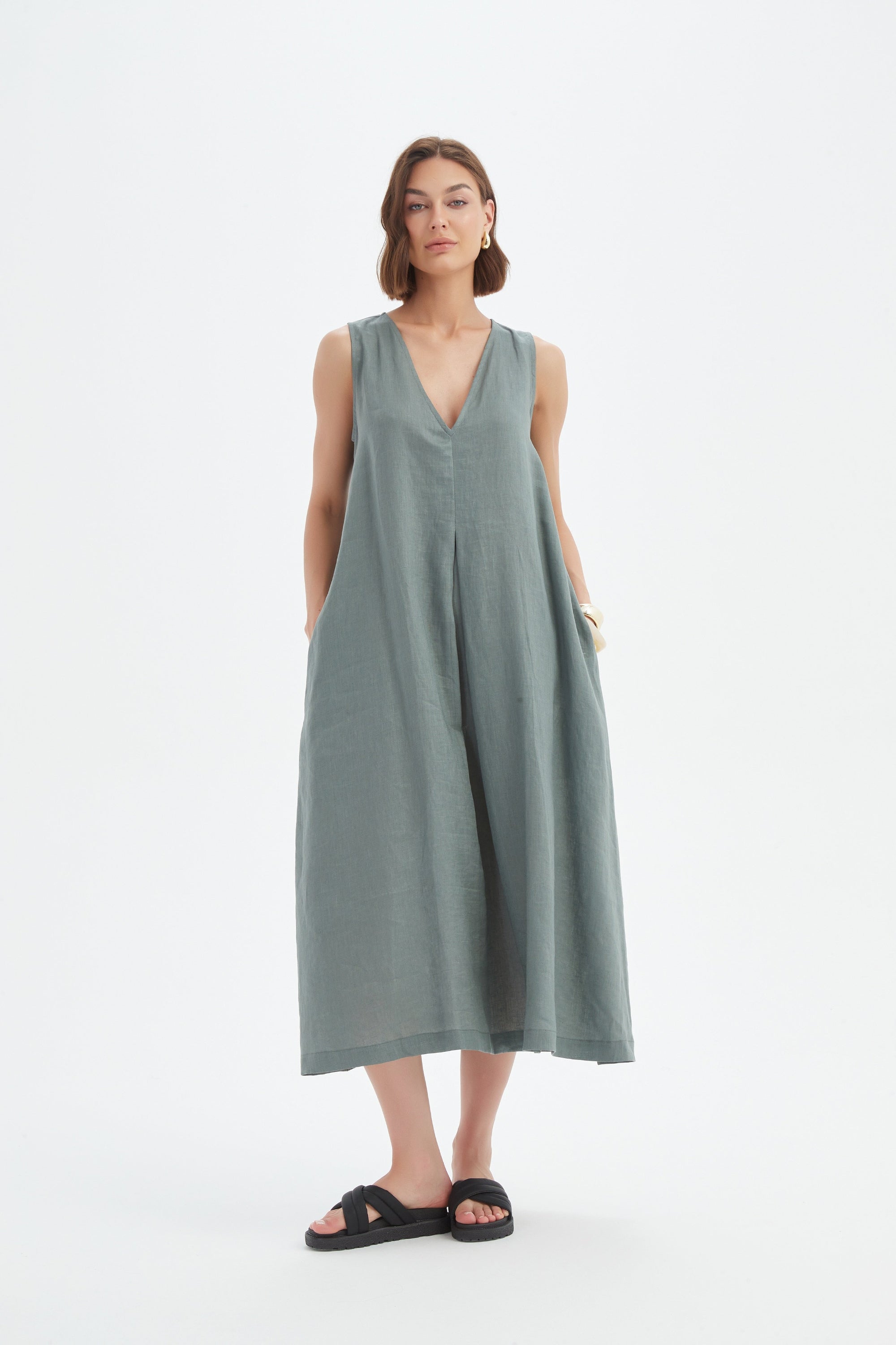 a-line pleat midi dress in petrol worn by model 