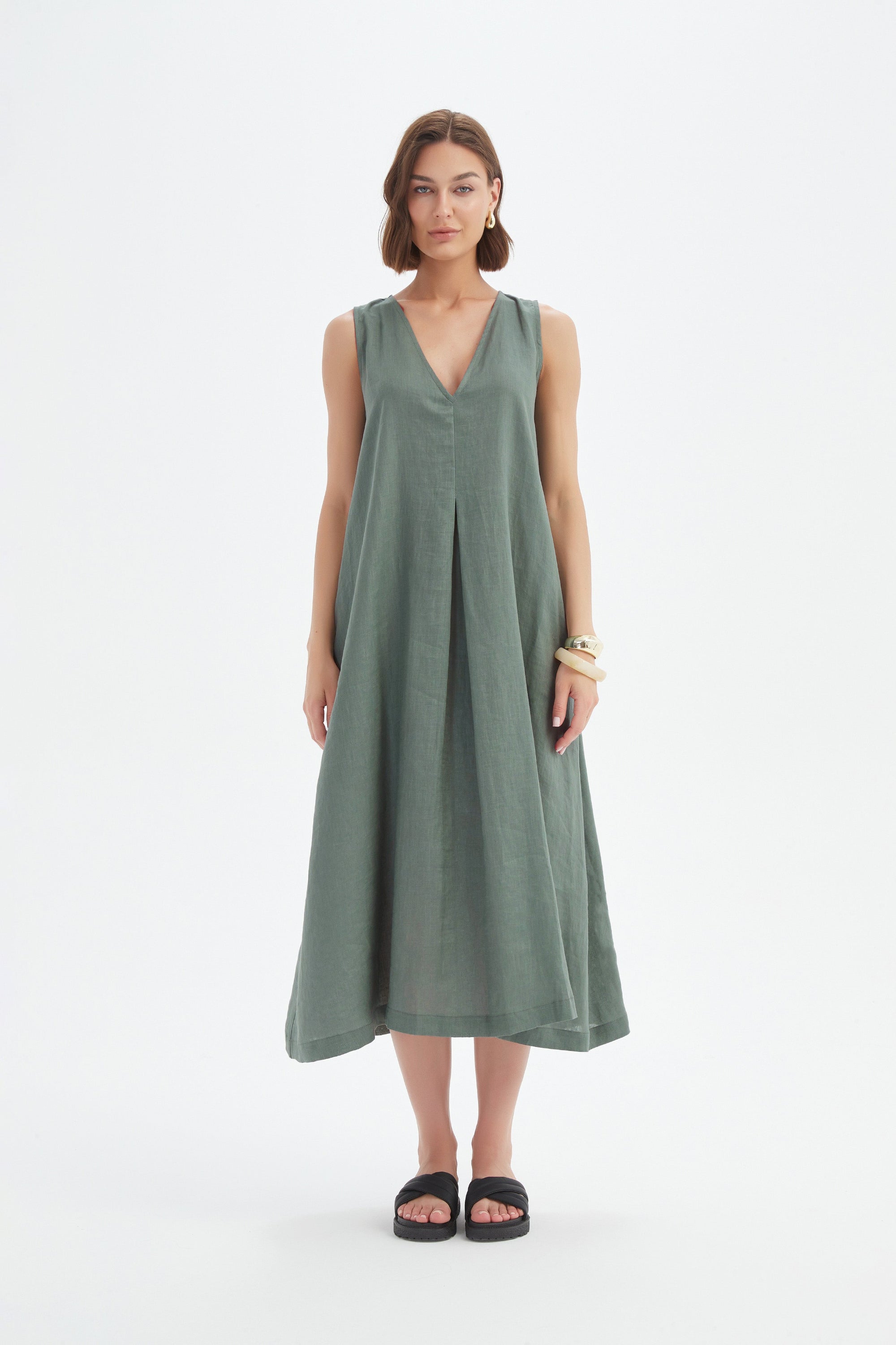 a-line pleat midi dress in petrol worn by model 