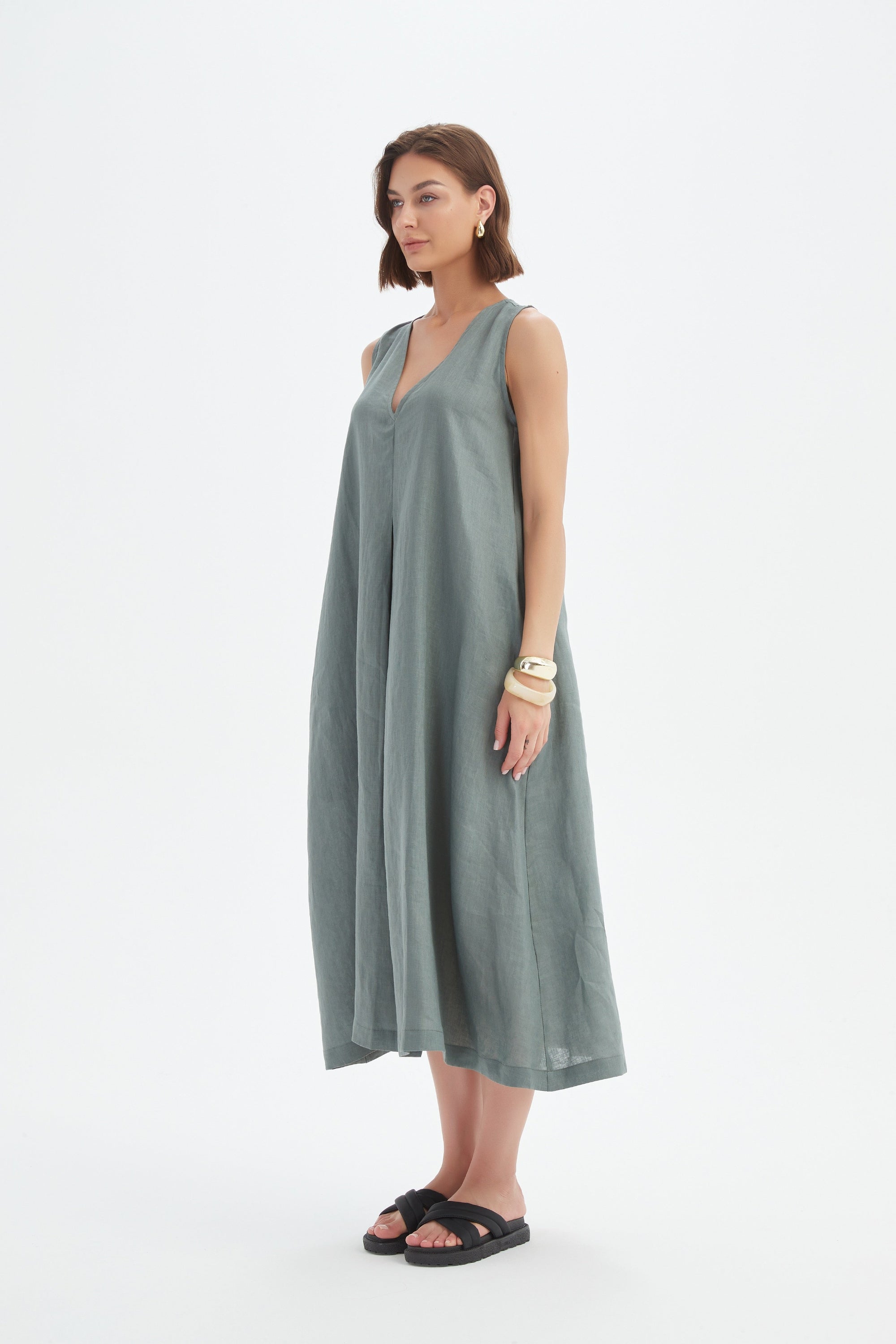 a-line pleat midi dress in petrol worn by model 