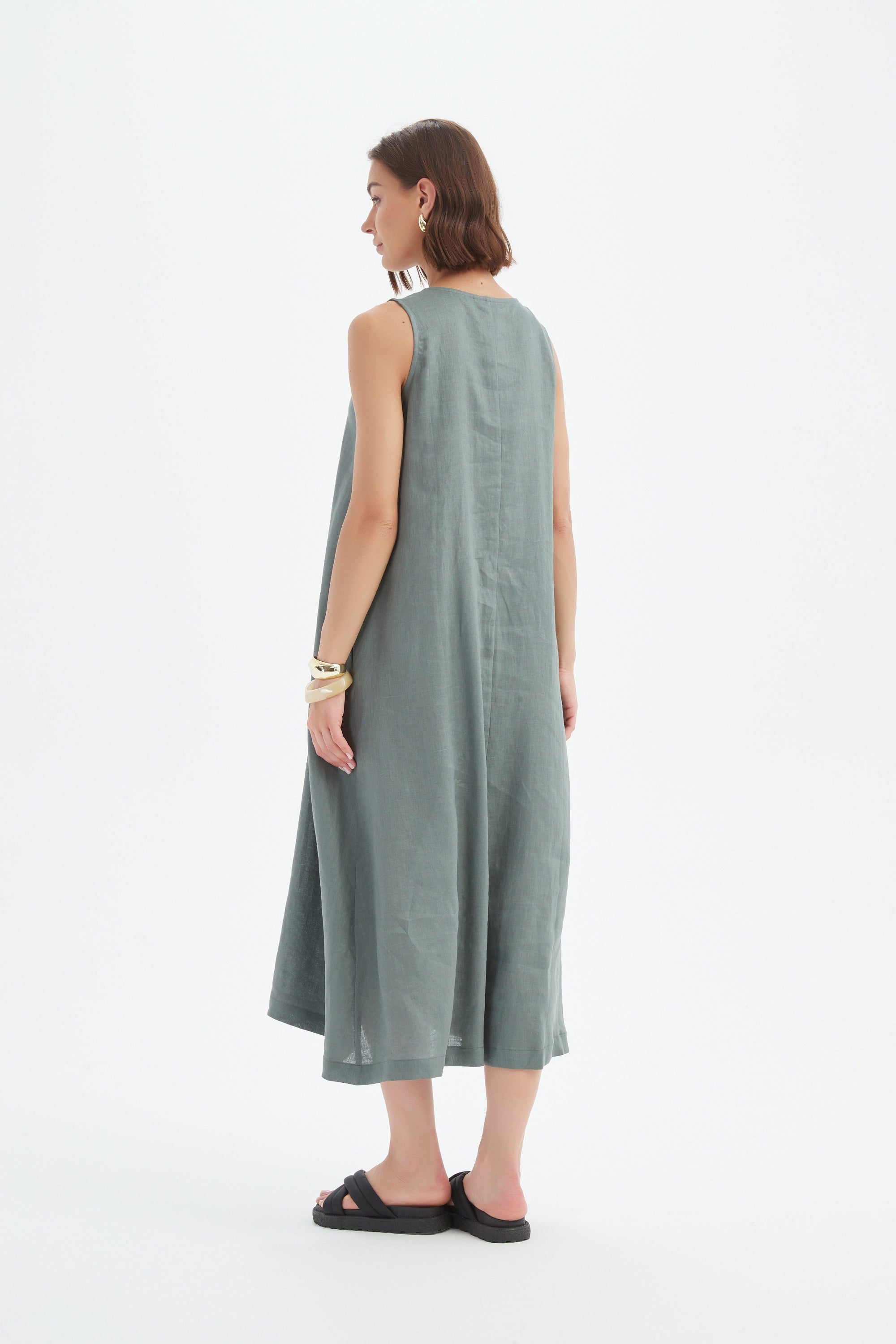a-line pleat midi dress in petrol worn by model back view