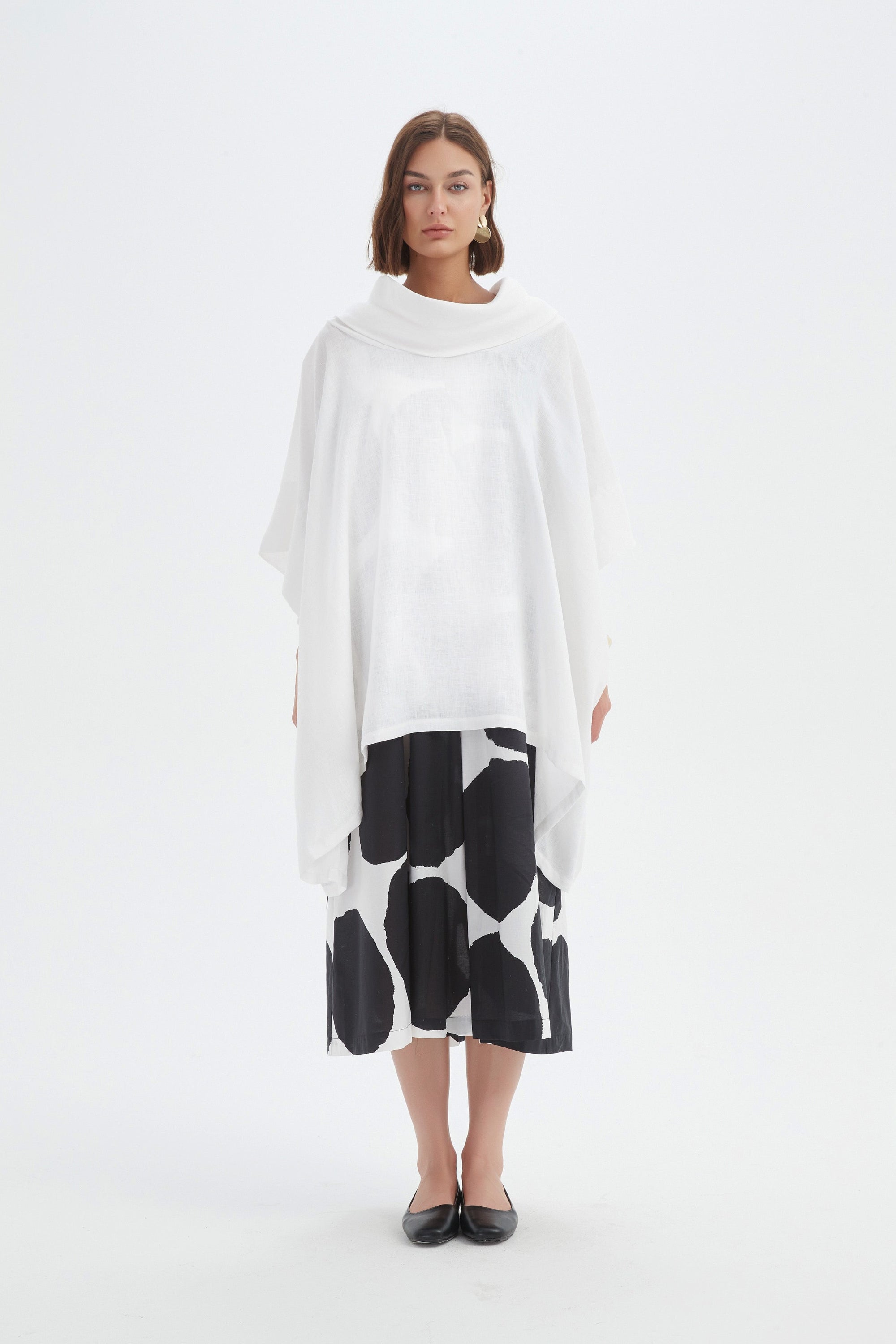 flowy waterfall poncho in white worn by model 