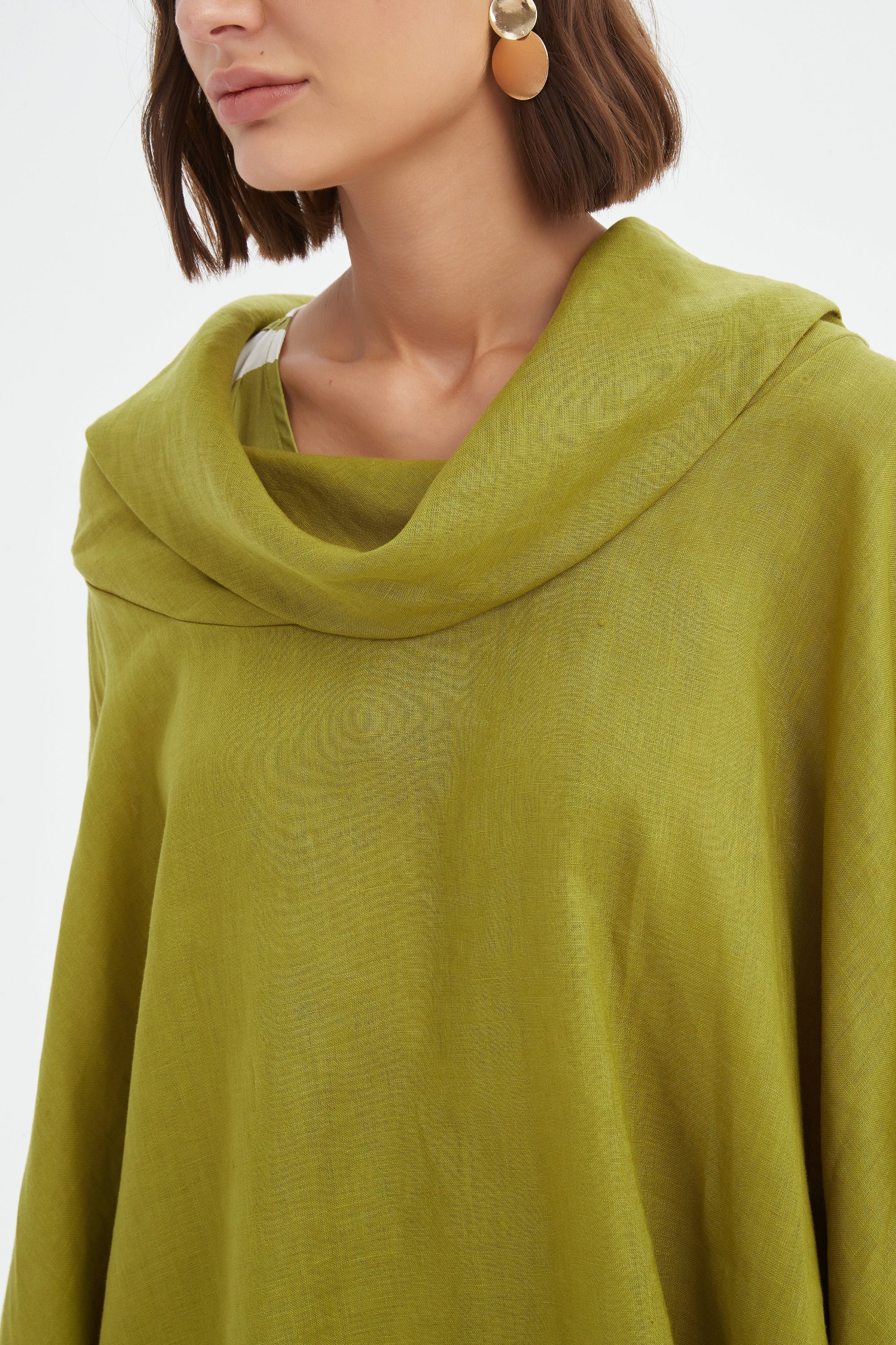flowy waterfall poncho in chartreuse worn by model close up