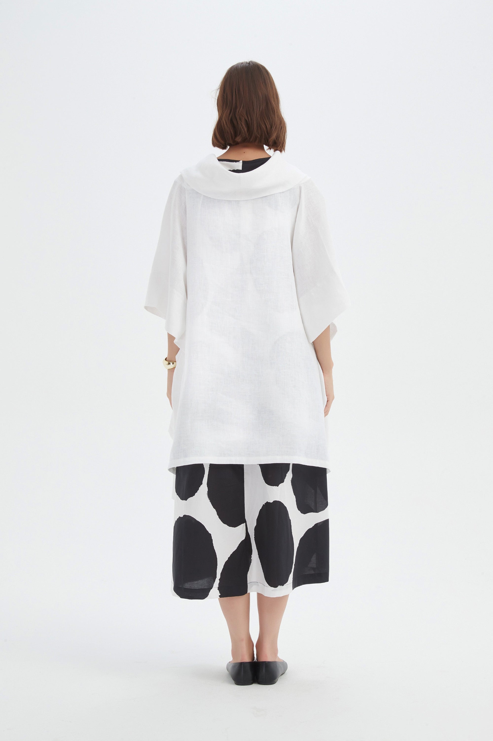flowy waterfall poncho in white worn by model back view
