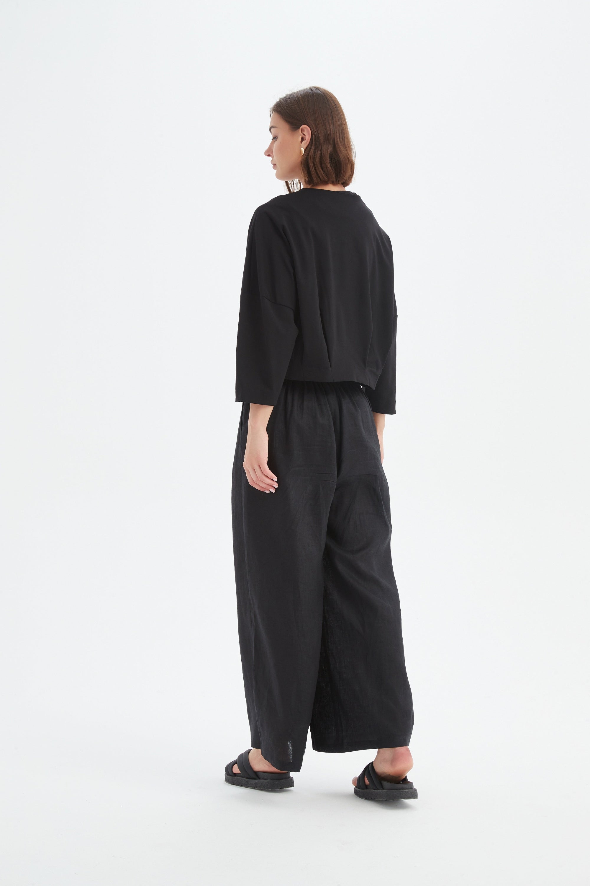 structured cardigan and pant in black worn by model back