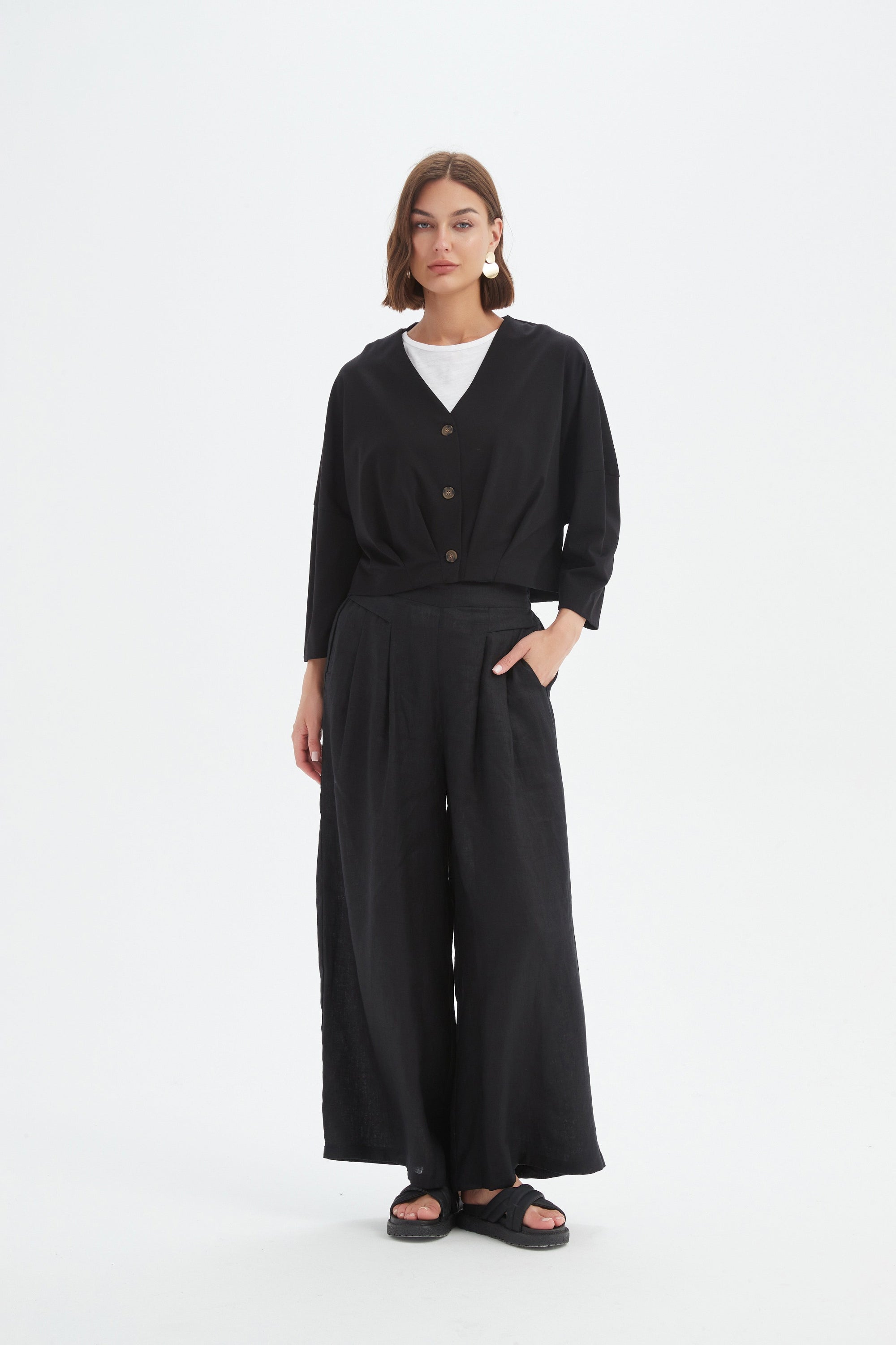 structured cardigan and pant in black worn by model