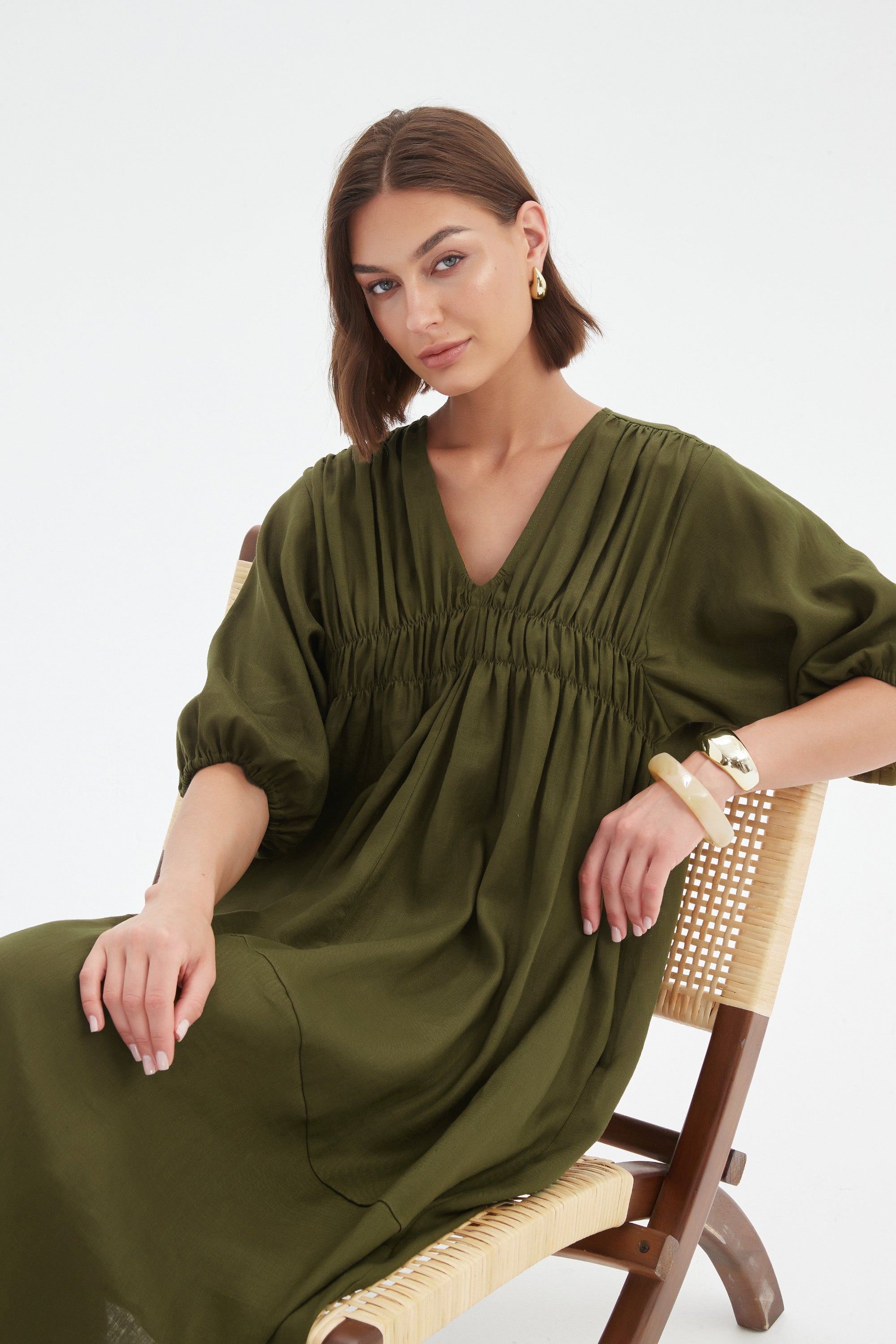 dark moss green midi dress worn by model 