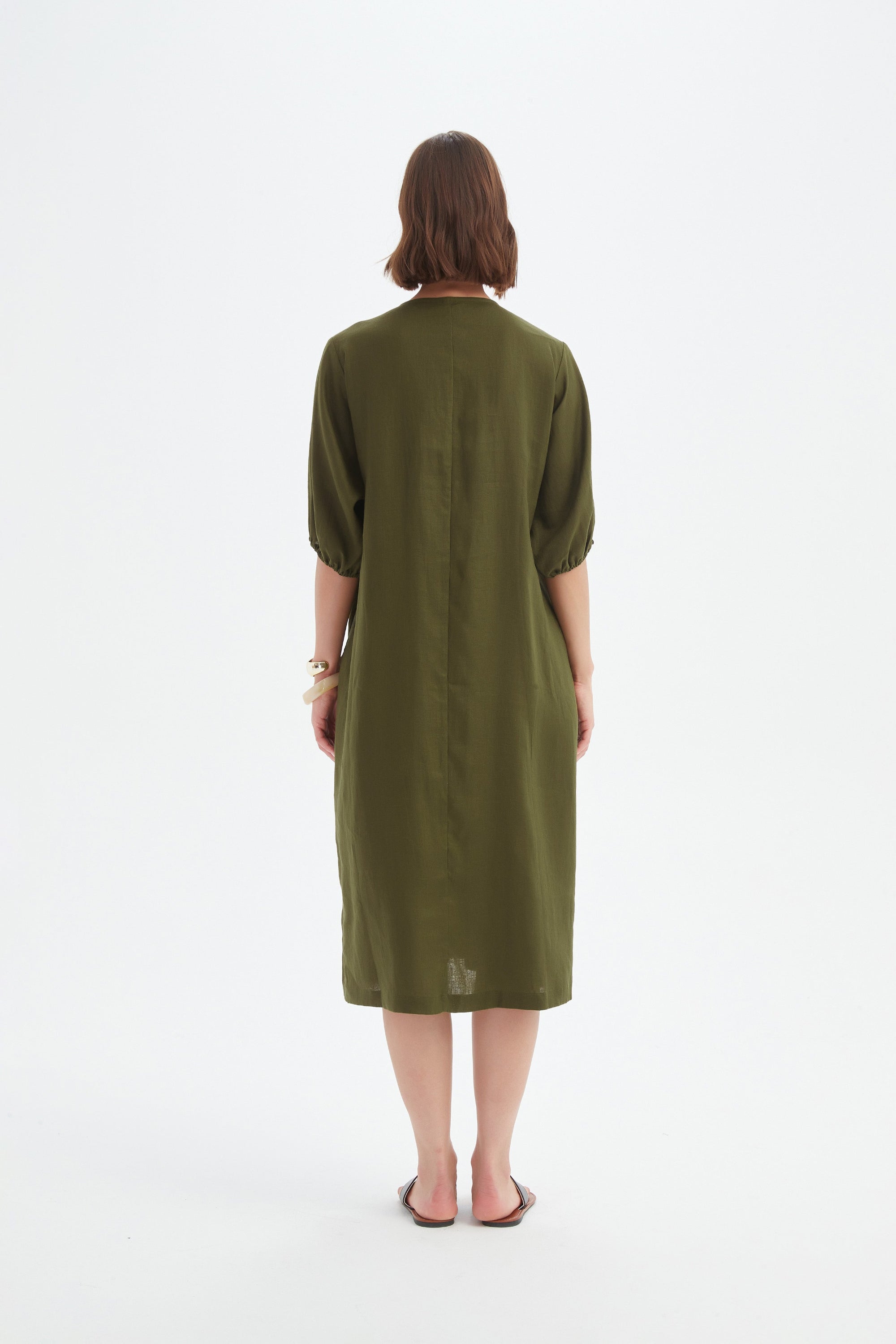dark moss green midi dress worn by model back