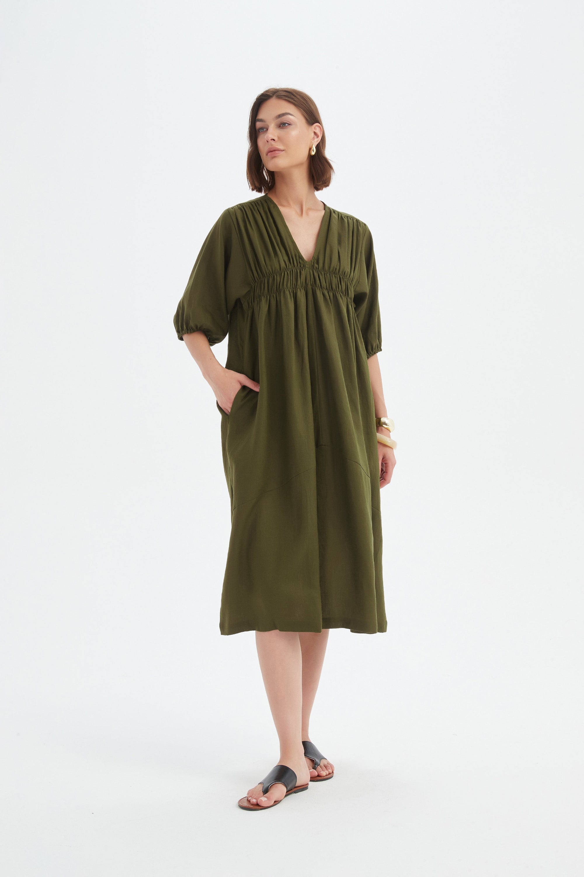 dark moss green midi dress worn by model 