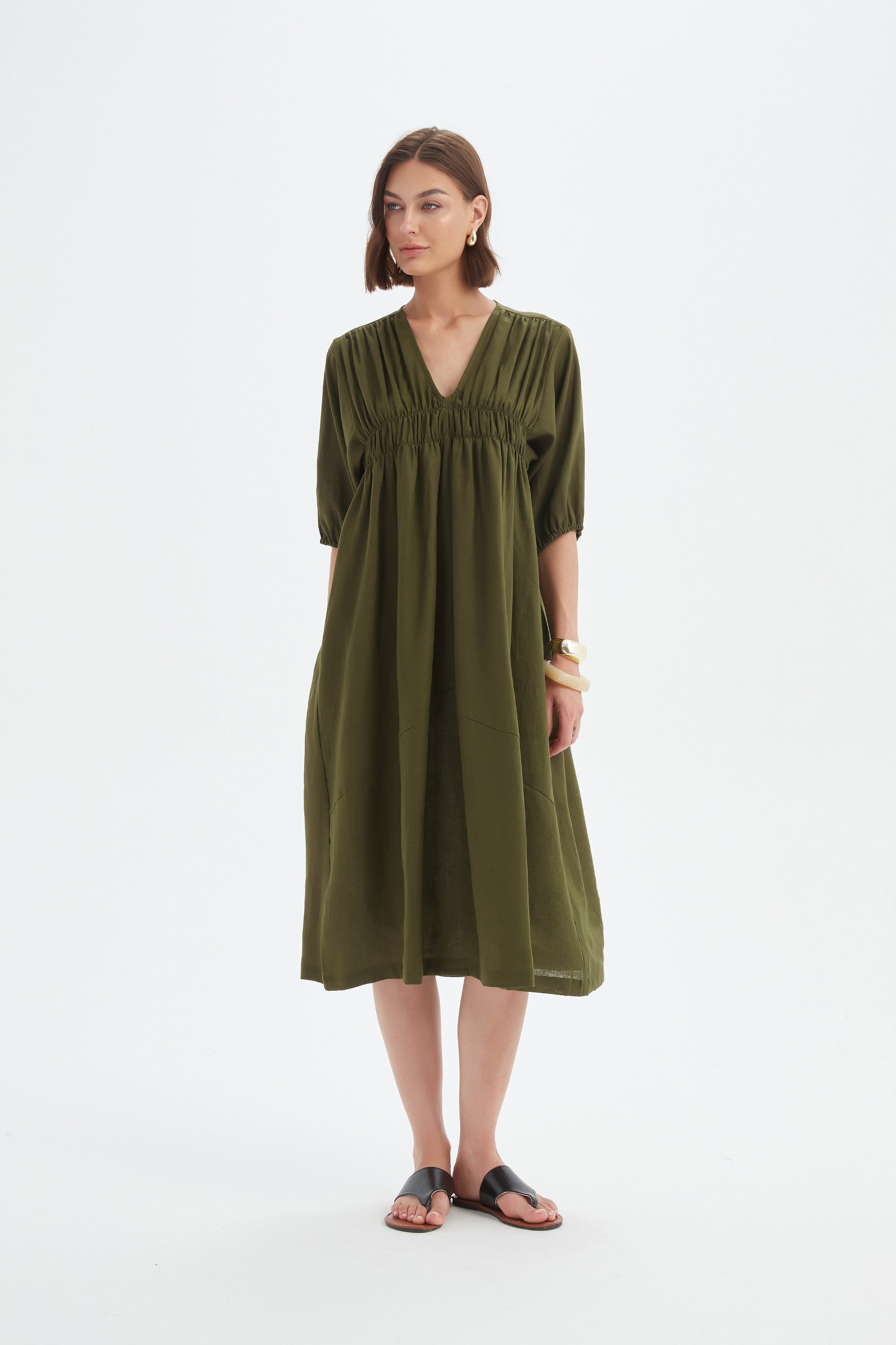dark moss green midi dress worn by model 