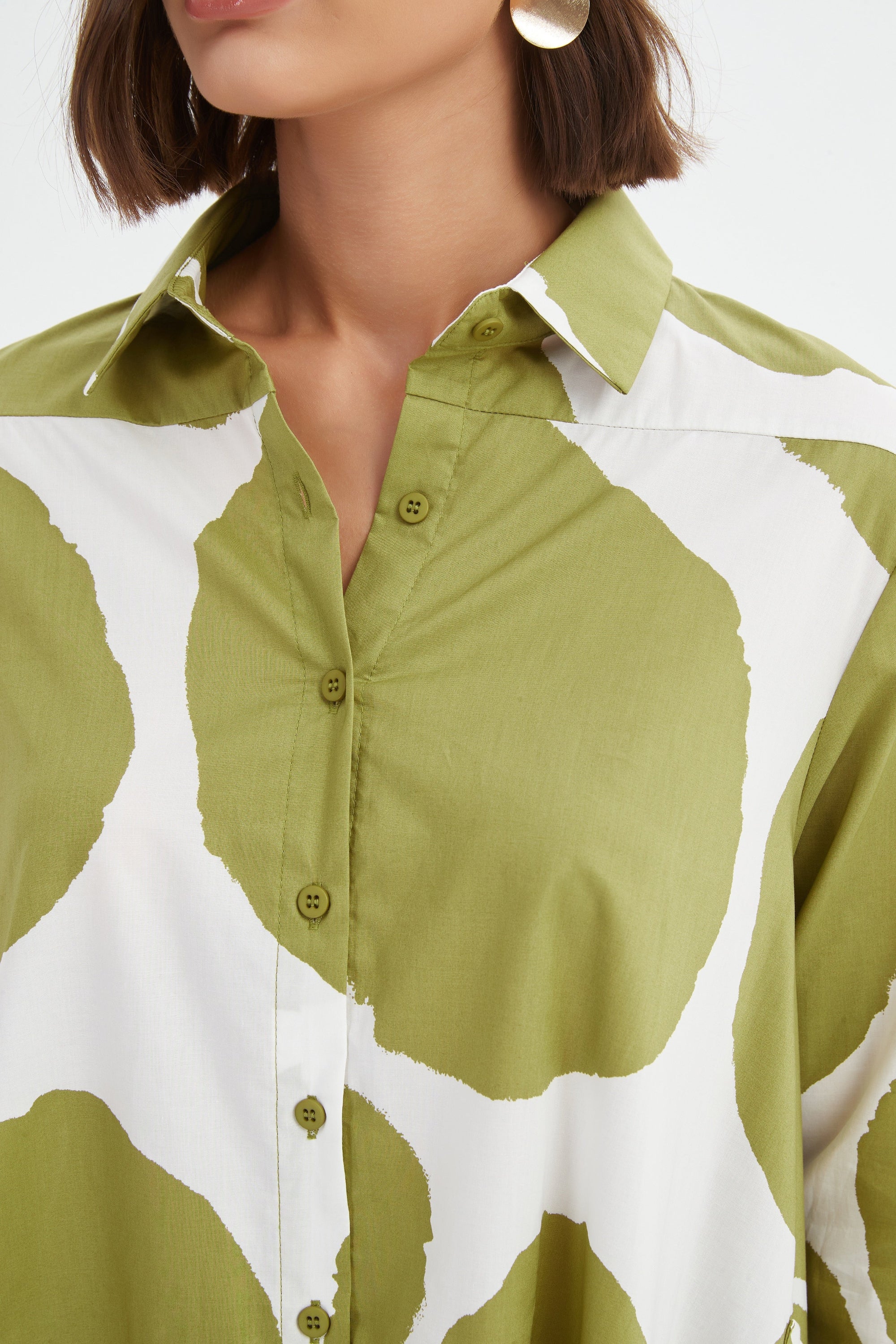 green and white spot longline shirt worn by model detail