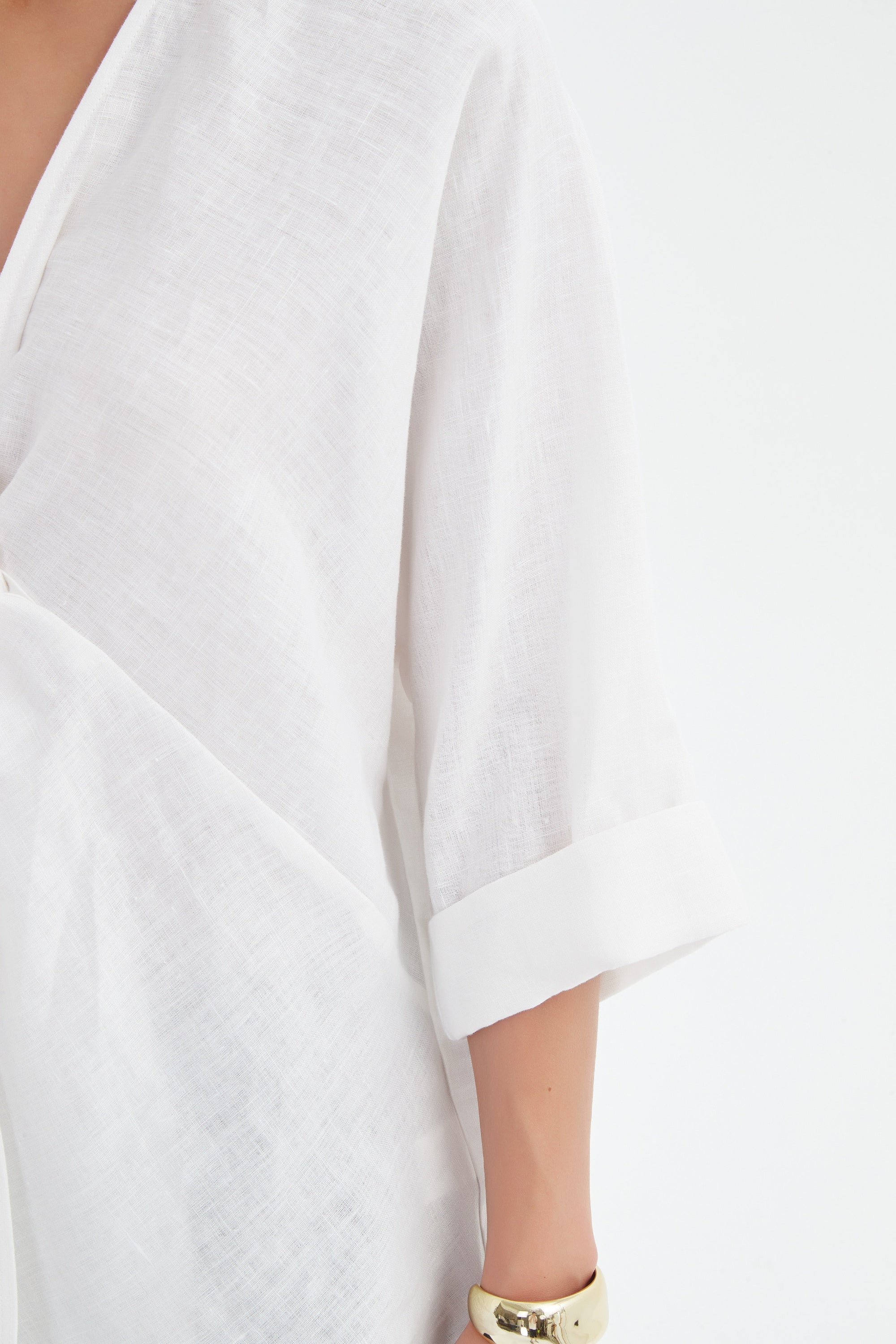 v neck twist front white blouse and black pants worn by model close up