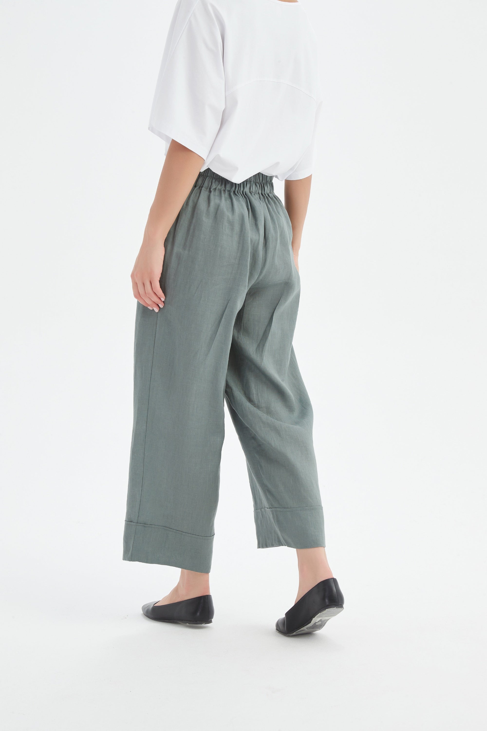 petrol wide leg linen pant and white tee worn by model back 