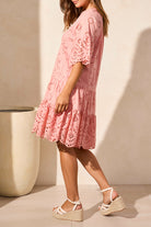 broderie anglaise midi dress in pink worn by model side view