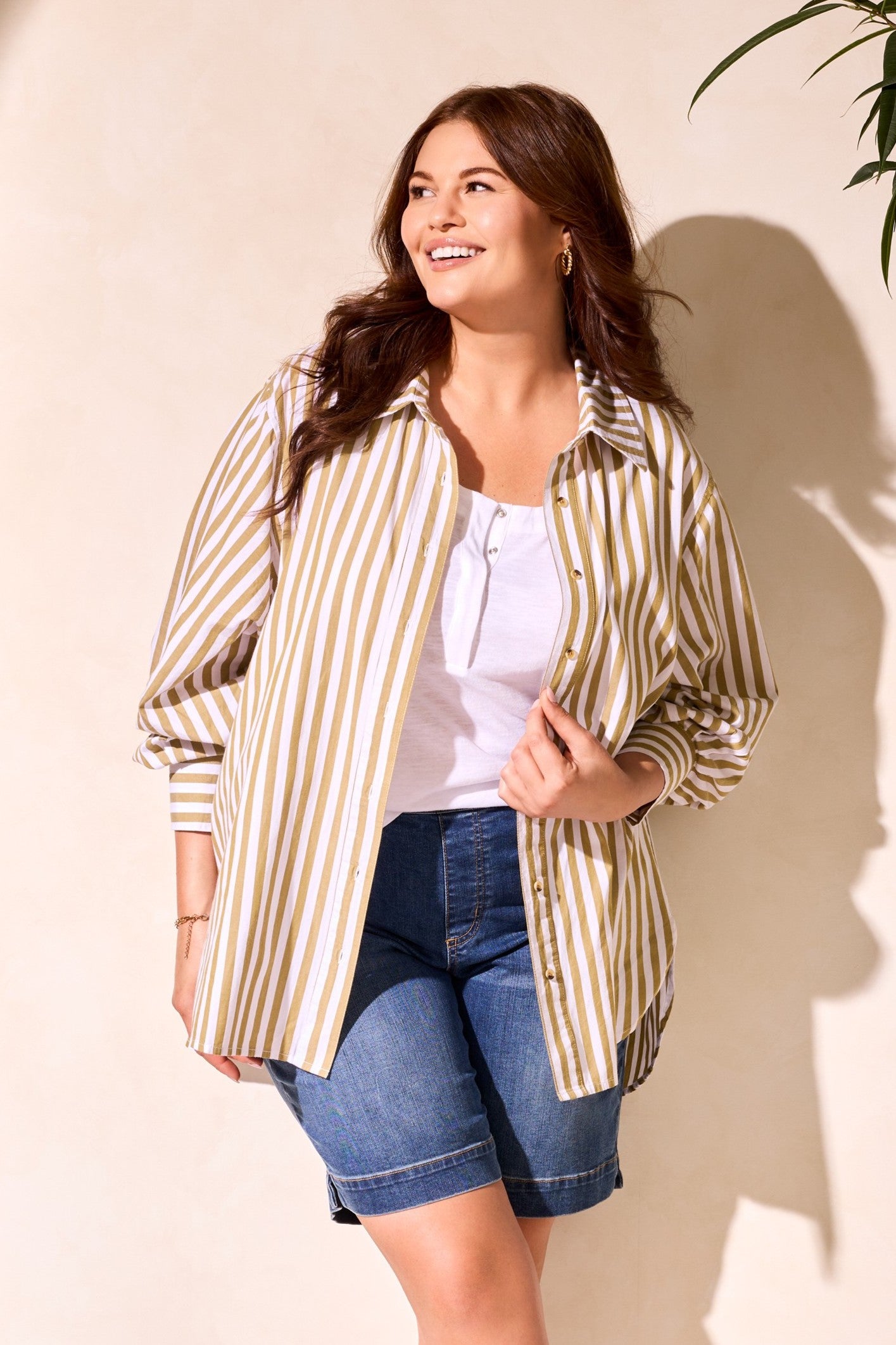 womens button through white and moss stripe shirt worn by model