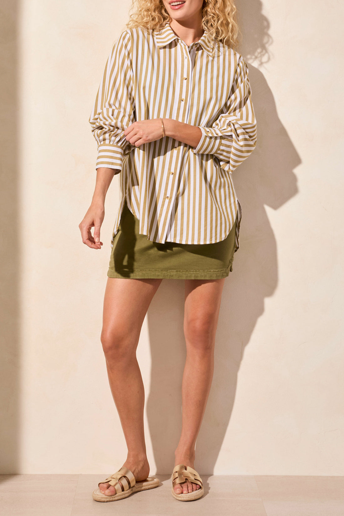 womens button through white and moss stripe shirt with green skirt worn by model