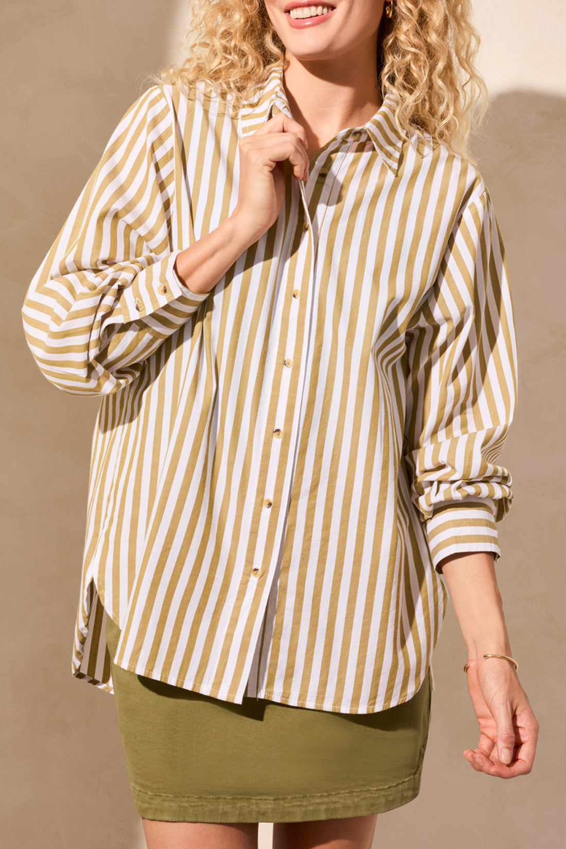 womens button through white and moss stripe shirt worn by model